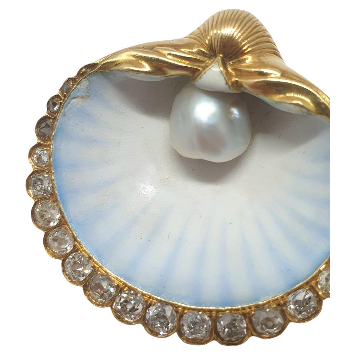 Antique french 18k gold shell brooch centered with 1 large natural white south sea pearl size 8mm diameter flanked with old mine cut diamonds and colorful enamel hall marked with 19th century french owl mark brooch lenght 4cm and total gold weight
