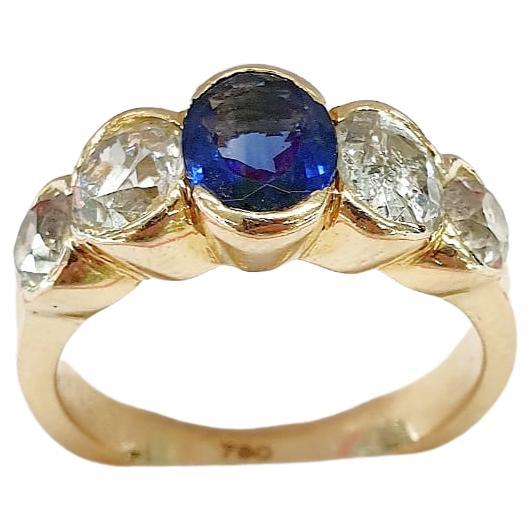 Antique 18k yellow gold french ring with natural navy blue sapphire colour estimate weight of 1.20 carars flnaked with 4 old mine cut diamonds with estimate weight of 2 carats H colour white vs clearity and si hall marked with french eagle assay
