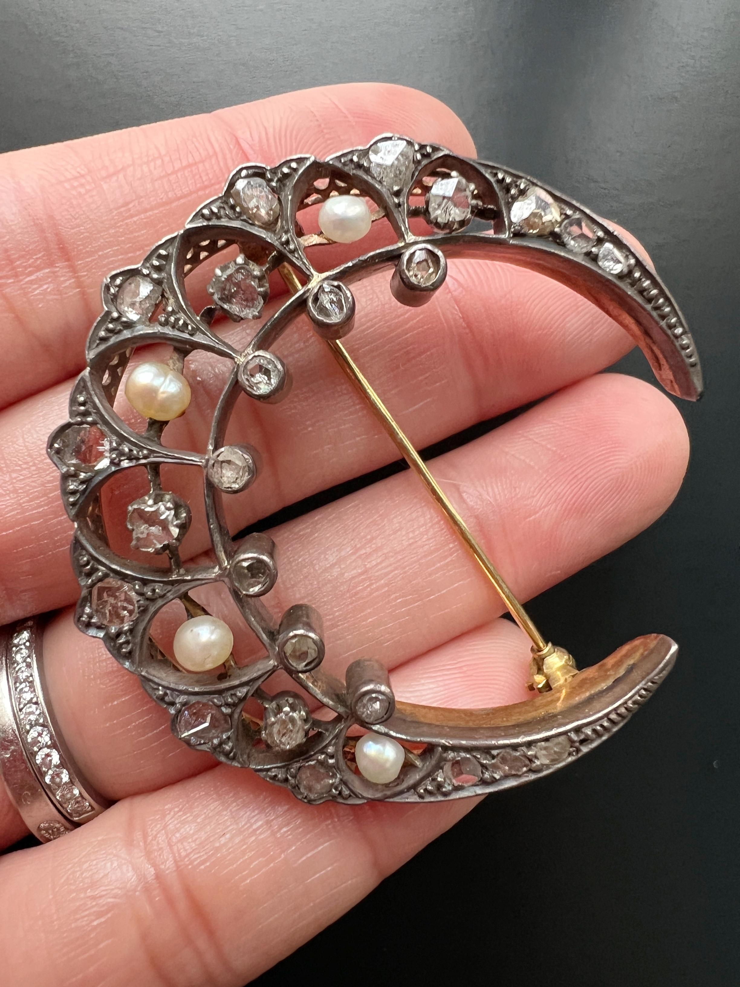 We absolutely love everything in this amazing large Victorian Crescent brooch: Its incredibly large size and hefty weight, its elegant silver on gold mounting (the diamonds are mounted in silver and the brooch in 18K yellow gold which is typical to