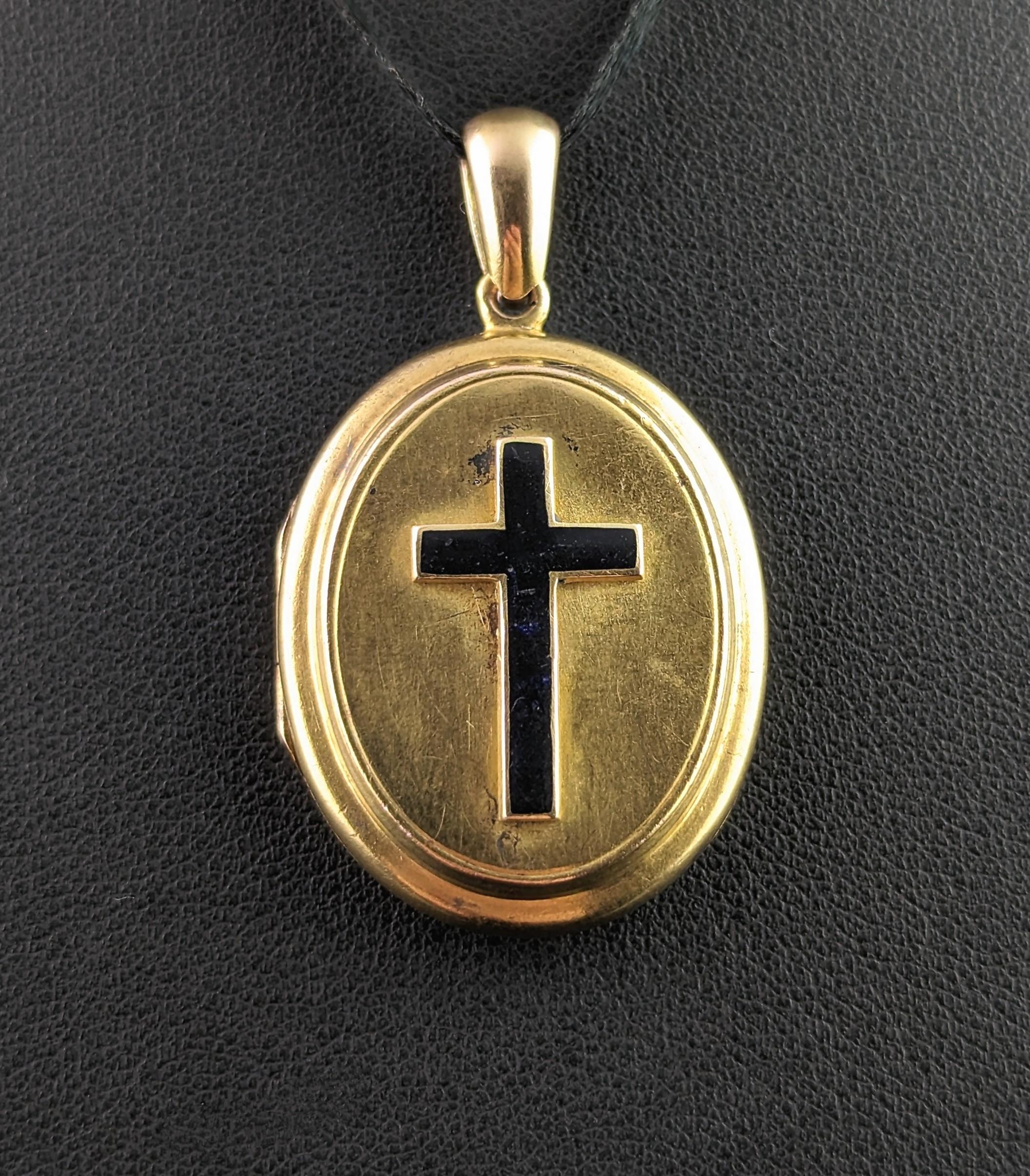 This beautiful antique 18kt gold Mourning locket is really a very special and sentimental piece.

Rich aged 18kt gold with a raised repousse cross applied to the front in inky black enamel, black being a commonly used colour on Mourning jewels and