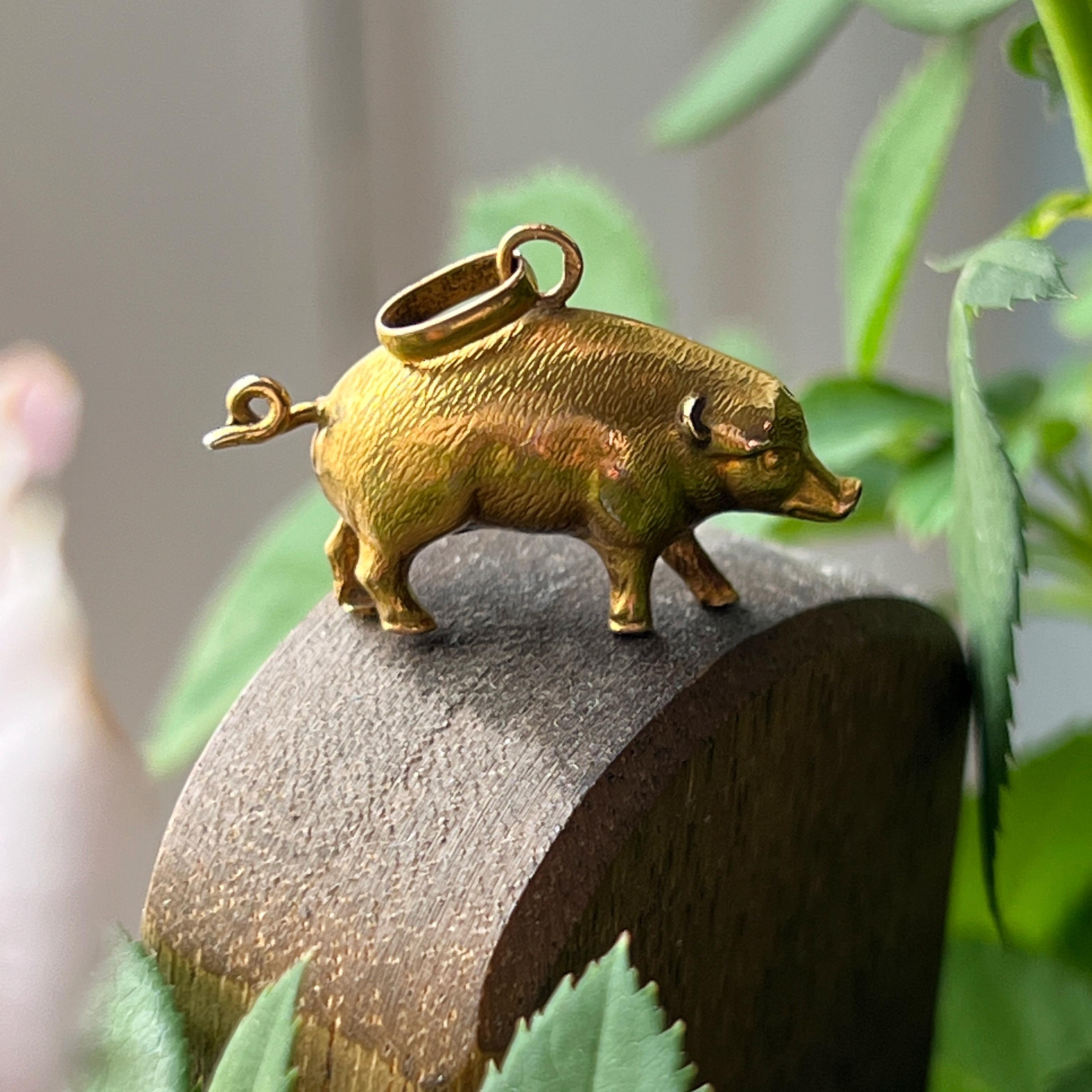 For sale an exquisite 18K yellow gold pig miniature pendant – a delightful embodiment of charm, luck, and happiness that will capture your heart and add a touch of whimsy to your jewelry collection.

Crafted with meticulous attention to detail, this