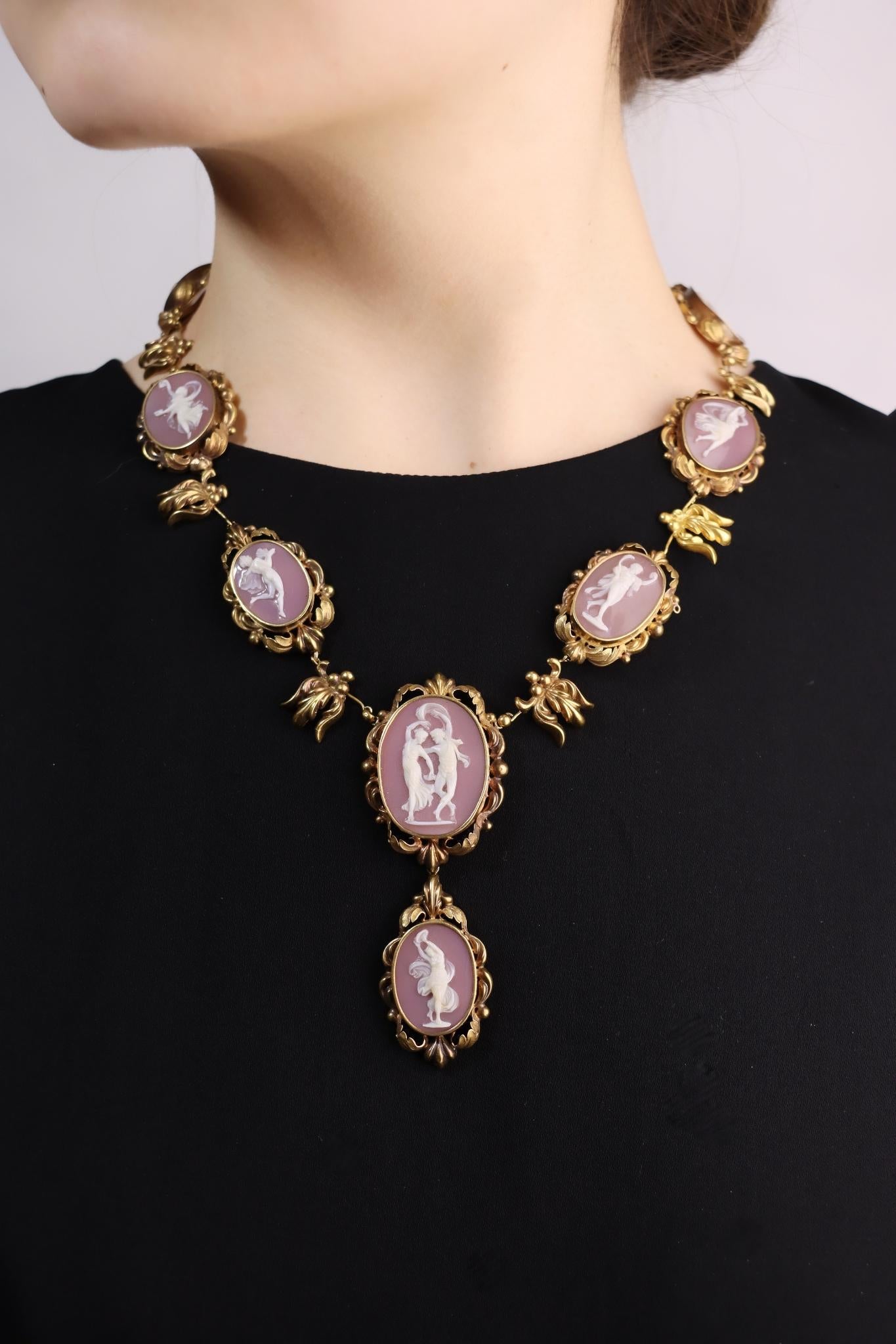 Antique 18K Gold Pink Agate Cameo Necklace

Approximate Dimensions:

49.5 cm (Length) 
1.5 - 2.5 cm (Width)
4 cm x 2.2 cm (Pendant)
58.0 grams in weight.