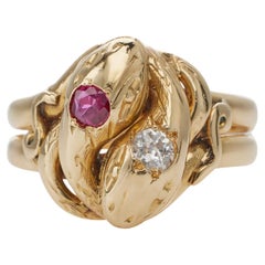 Ancienne bague double serpent en or 18K, rubis et diamants
