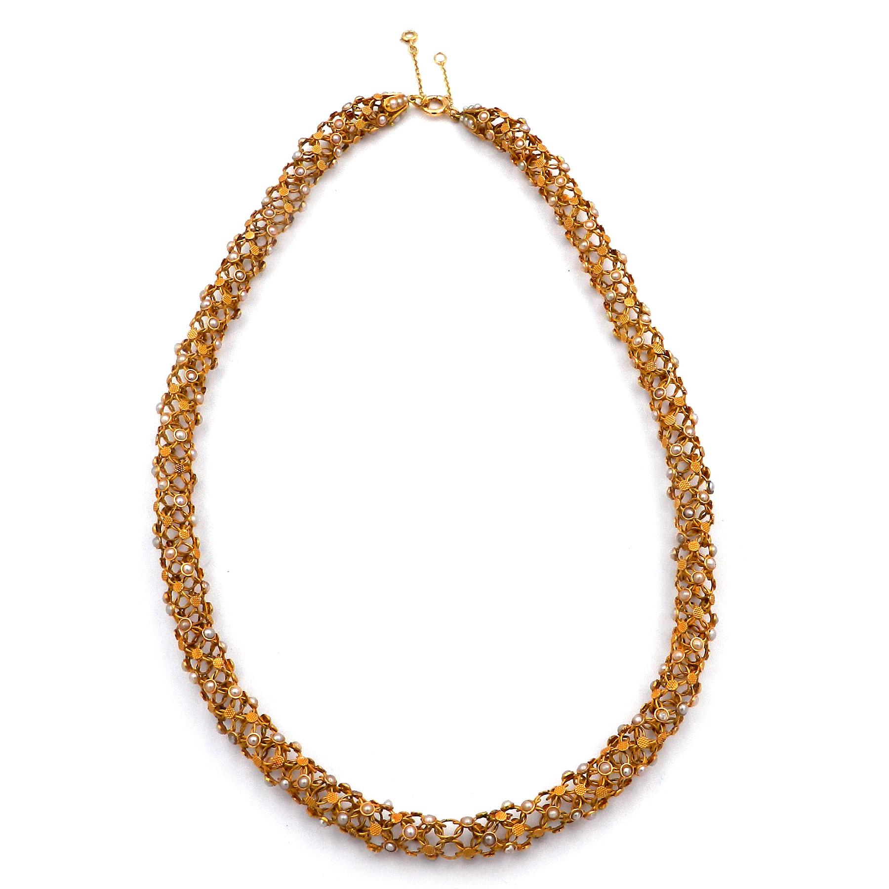 Antique 18K Gold Woven Oriental Pearl Tube Necklace, Paris circa 1870

This antique gold necklace is made from 18K/750 rose gold. It was made in Paris around 1870/80. This extraordinary necklace is designed like a tube from fine interwoven mesh, set