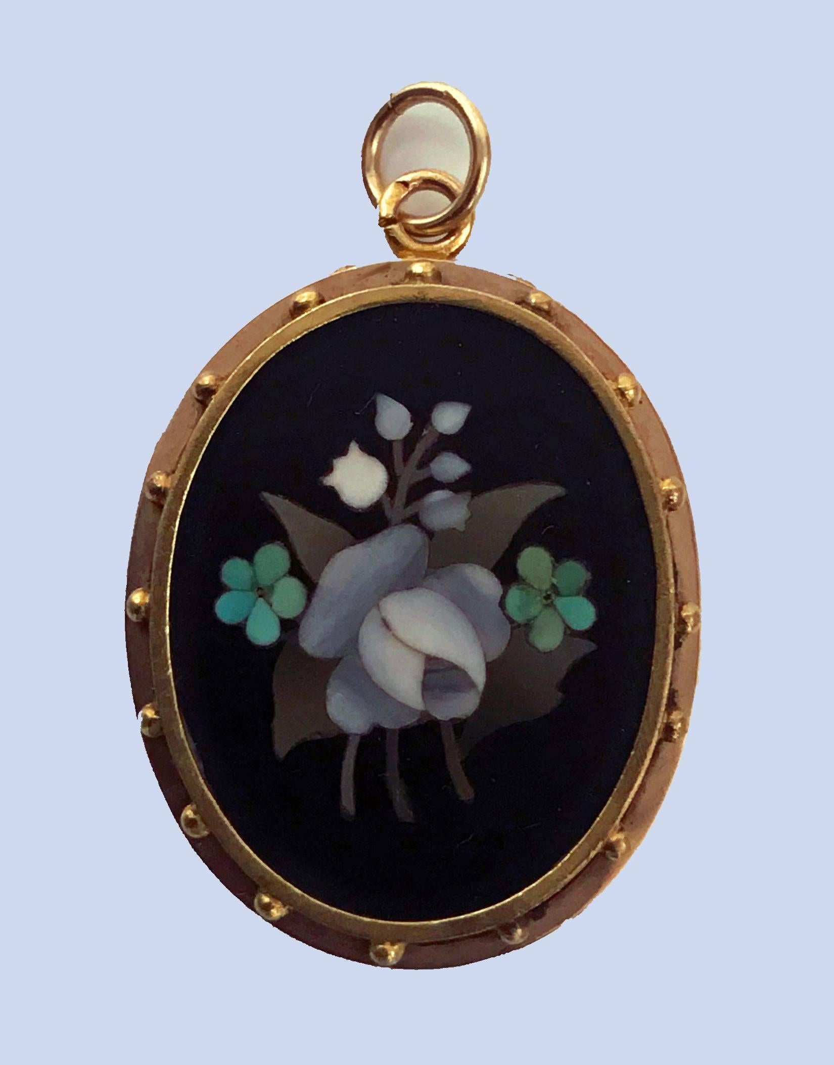 Antique 18K Gold Pietra Dura Pendant Locket, Italy C.1875. The Pendant Locket of oval shape, fine pietra dura floral white, green, lilac inlay colors, the surround gold mount of bead work. The reverse with hinged vacant locket. Gold acid tests 18K.