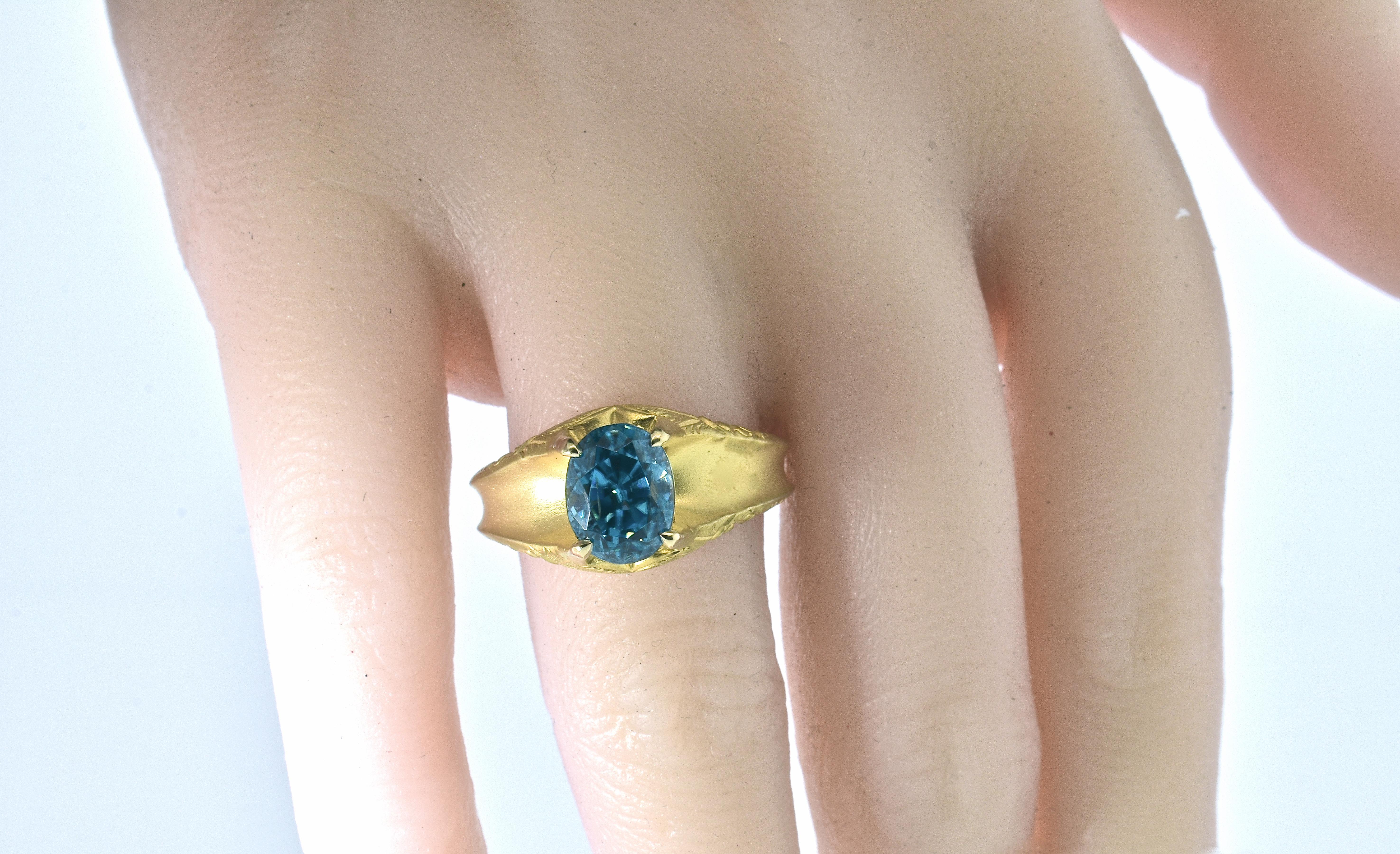 Antique Victorian 18K gold ring centering a very fine natural blue zircon weighing an estimated 7.50 cts.  This oval stone is intensely brilliant and a vivid blue color and free of inclusions. This Victorian ring is from the last quarter of the 19th