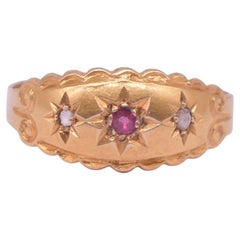 Anello da incasso con rubino e diamante a stella 18 carati e fascia smerlata in oro, HM 1913