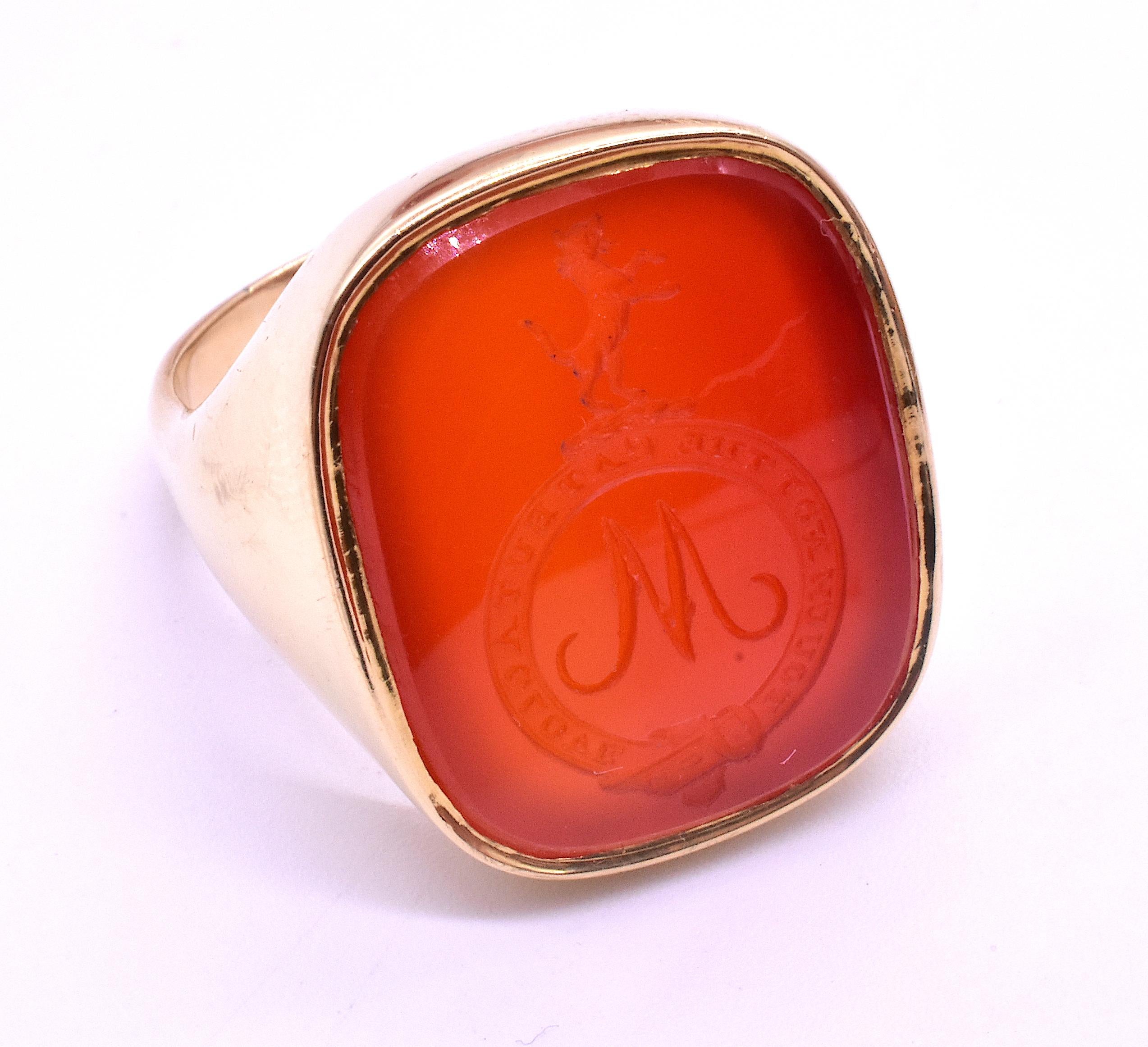 Fabulous Scottish carnelian signet ring with a fierce looking Scottish wildcat in mid growl or hiss standing on his or her hind legs. Below the banner is a monogram of the letter W or M, take your pick! The motto reads 
