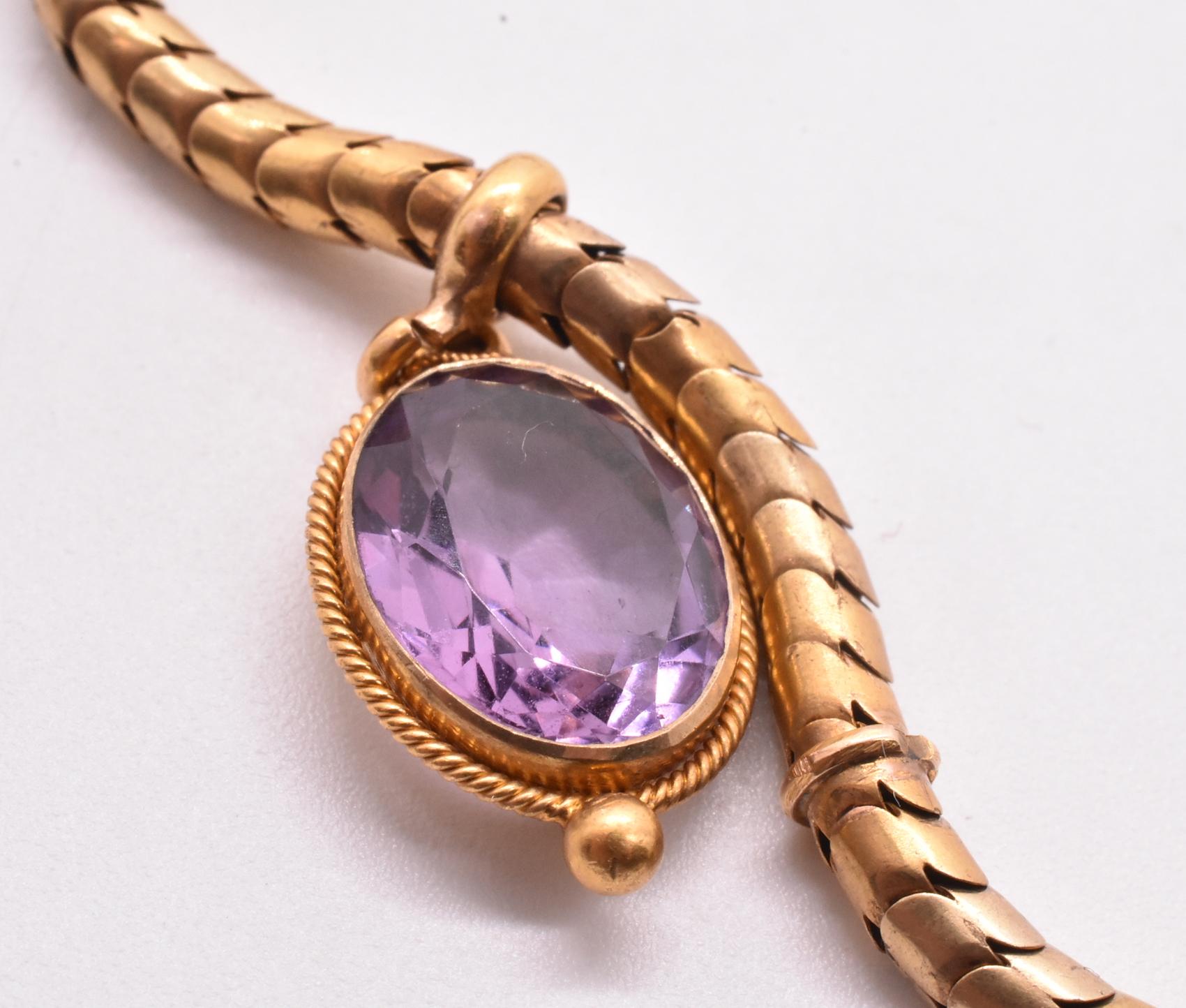 This romantic amethyst 18k necklace has a smooth and sultry snake chain that feels as good as it looks. The glittering large five amethysts fall symmetrically about the chain and always fall perfectly on the neck, with the central largest amethyst