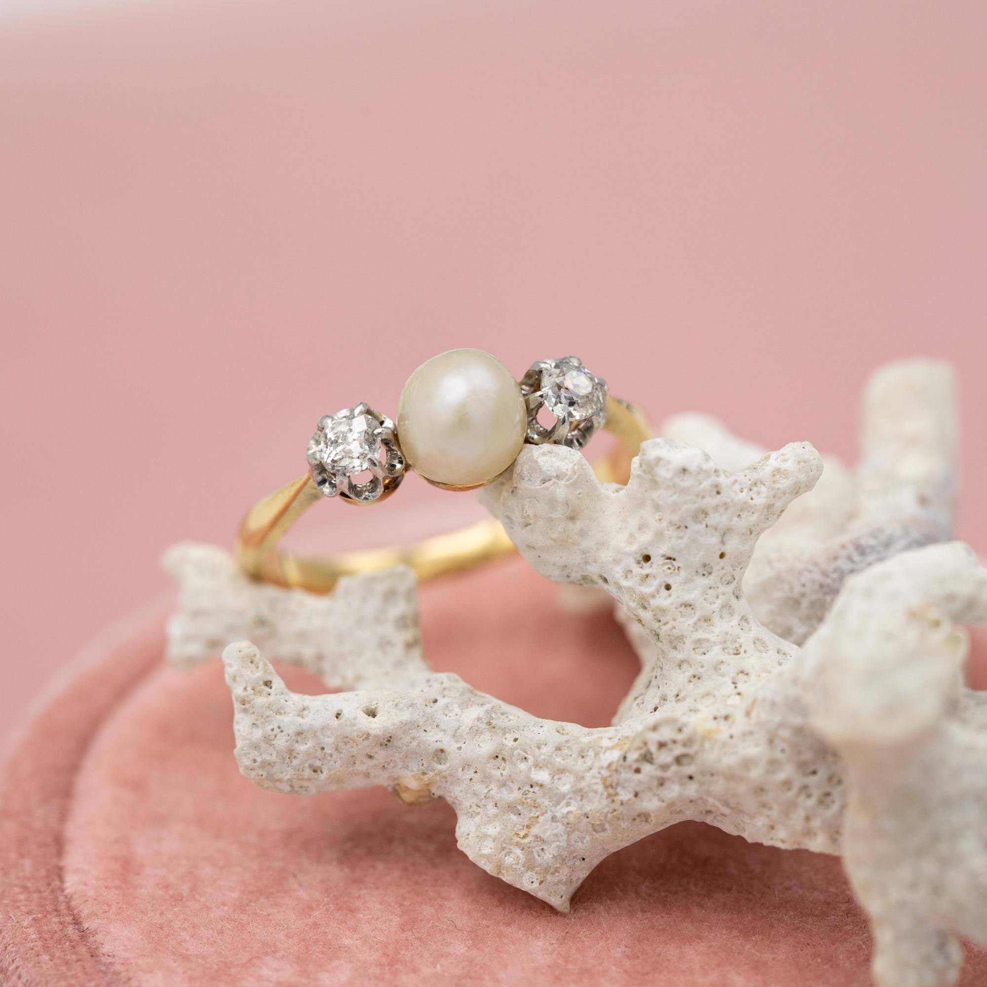 For sale is antique 18 karat yellow gold ring which stole our hearts the minute we laid eyes on her. This marvellous ring is made in solid yellow gold and decorated with a pearl and two old miner cut diamonds. These three stunners represent pure