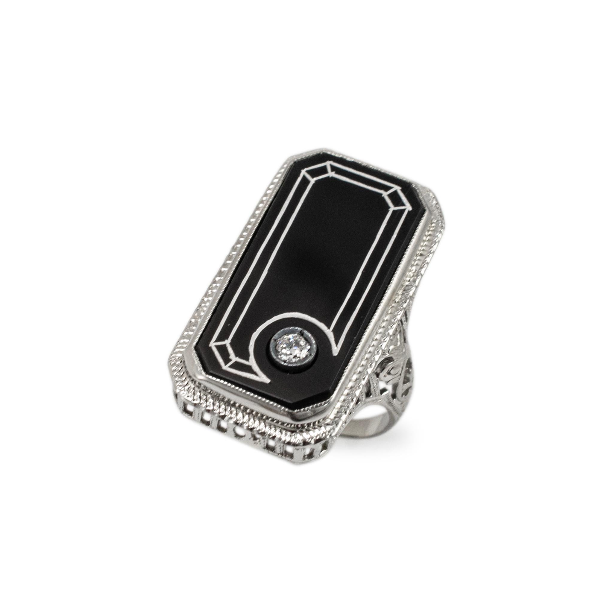 Gender: Ladies

Metal Type: 18K White Gold

Ring Size: 5.5

Head measures: 26.00 mm x 14.30 mm

Shank maximum width: 2.90 mm

Weight: 6.14 grams

18K White Gold diamond and onyx antique cocktail ring with a half round shank. The metal was tested and