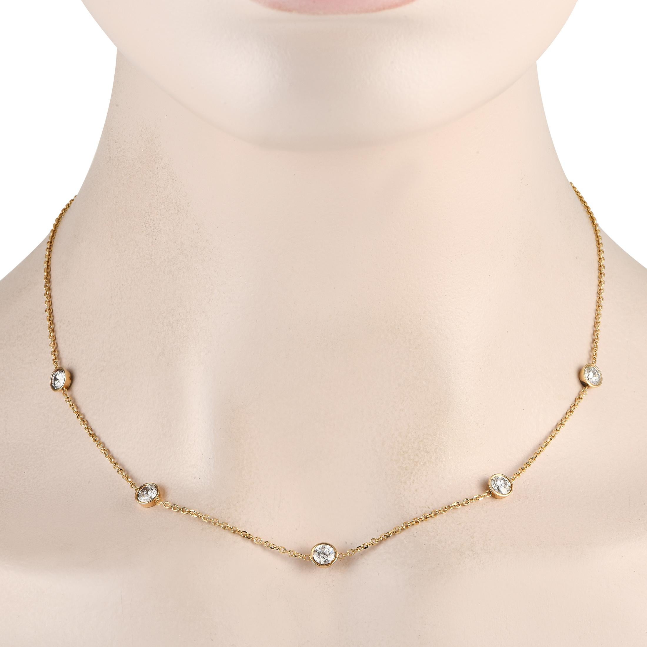 This antique diamond station necklace is ready to dot your neckline with just the right amount of sparkle. An piece, this jewel features a 17.5-long chain in 18K yellow gold. Set at evenly spaced stations are five round brilliant diamonds secured in
