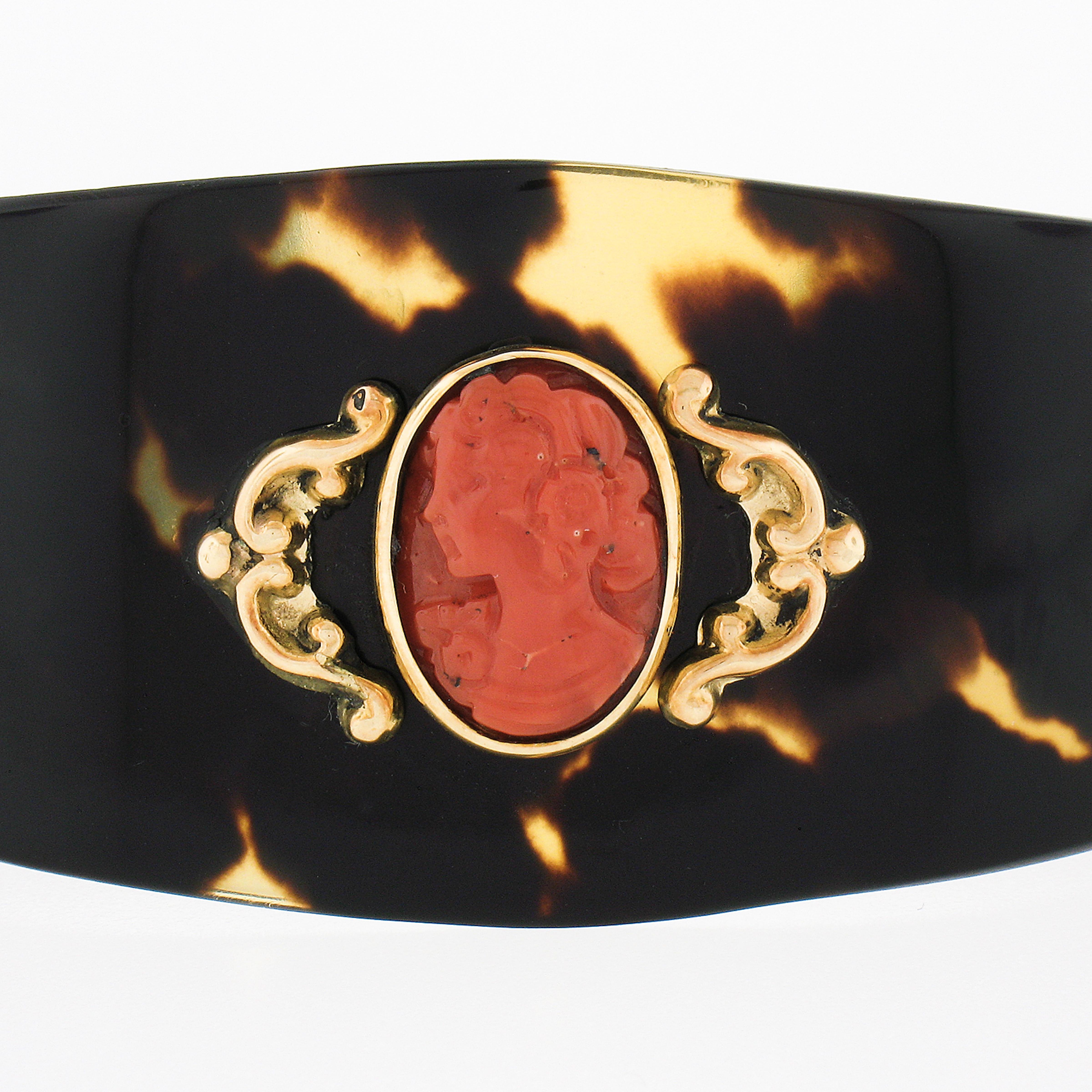 This beautiful, antique, wide cuff bracelet is constructed from lovely black stone that has nice high polished finishing throughout and features a high quality natural coral stone that has been carved into, showing a beautiful woman with wonderful