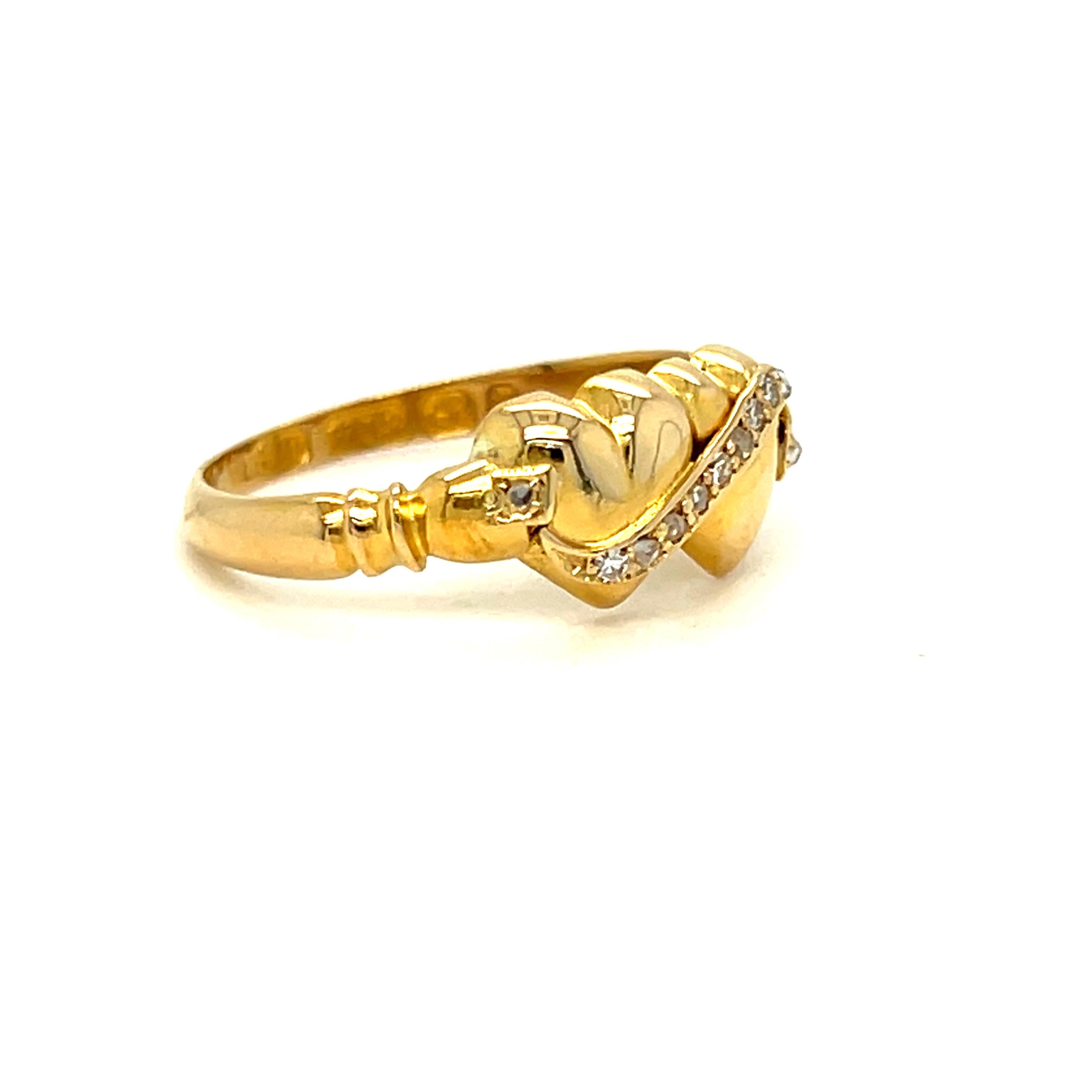 This Vintage Double Heart Diamond Engagement Ring is just so sweet!! Crafted in 18K Yellow Gold in 1897, the ring features a pair of hearts, with a diamond ribbon across. There are a total of 12 Single Cut Diamonds, totaling approximately 0.06ct, of
