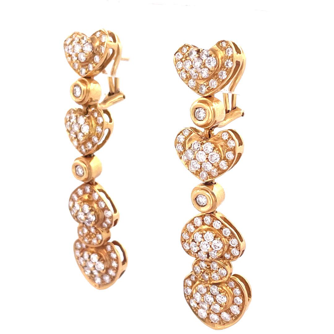 Enhance your allure with these exquisite antique 18K yellow gold heart drop diamond earrings. Crafted with attention to details, this earring shows heart motif diamond drop earrings with round brilliant diamonds of 4.5 TCW. Weighting 23.2 grams