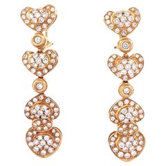 Boucles d'oreilles anciennes en or jaune 18k avec pendants en forme de coeur et diamants