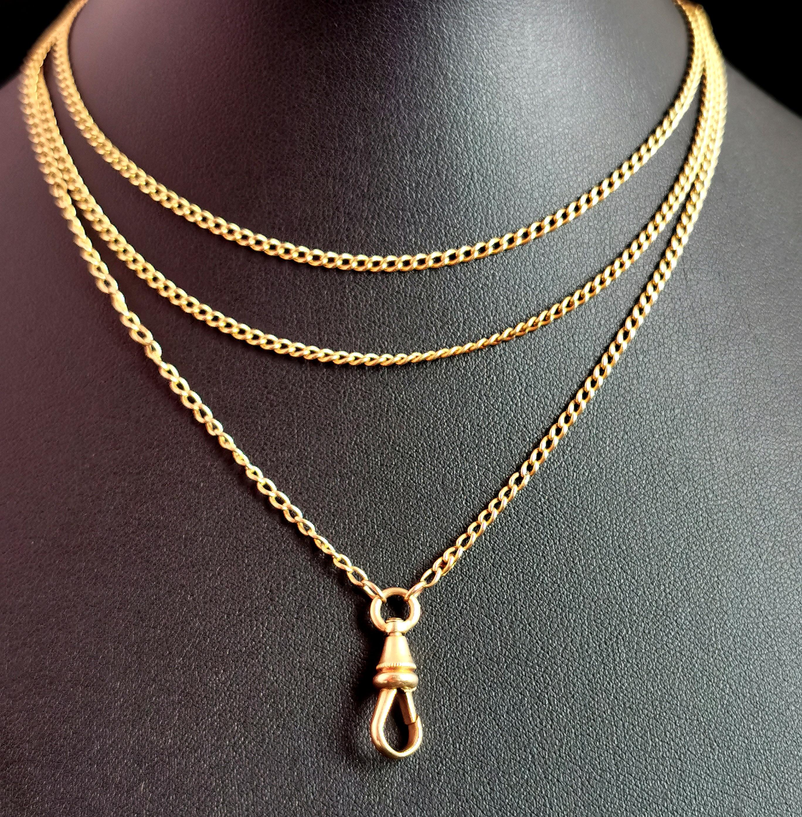 A beautiful antique, late Victorian era 18kt gold longuard chain necklace.

The lush, rich 18kt gold is warm and and inviting with a hue that is highly sought after.

It has elongated curb links with an attached dog clip fastener and an 18c tag to