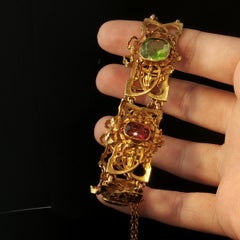 Antikes Armband aus 18-karätigem Gelbgold mit Peridot und rosa Turmalin im Jugendstil mit Schleifenmotiv