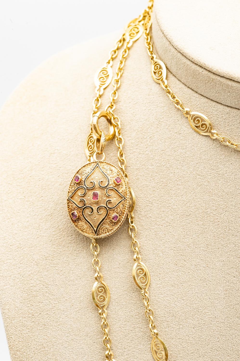 Antique 18K Yellow Gold Photo Holder Pendant
with Rubies and Fine Pearls

18 karat yellow gold handmade decorations on the front and back. In the front are positioned 5 Rubies, in the back are positioned 7 Rubies with 8 Fine Pearls. Keep your loved