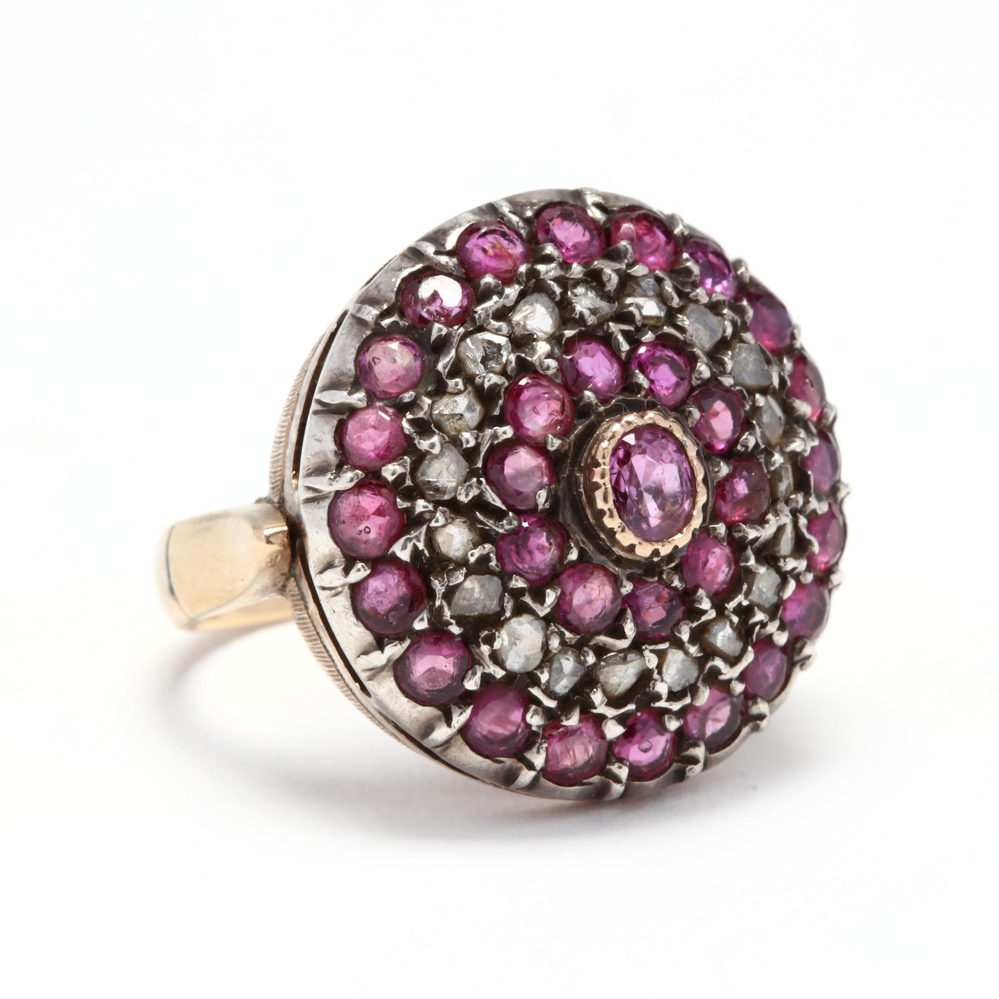 An antique 18 karat yellow gold, silver, diamond and ruby target ring. This ring features a bezel set, oval cut ruby center stone surrounded by three halos of round cut ruby and diamond accents.

Stones:
- rubies
- oval cut, 1 stone
- 4 x 3 mm
-