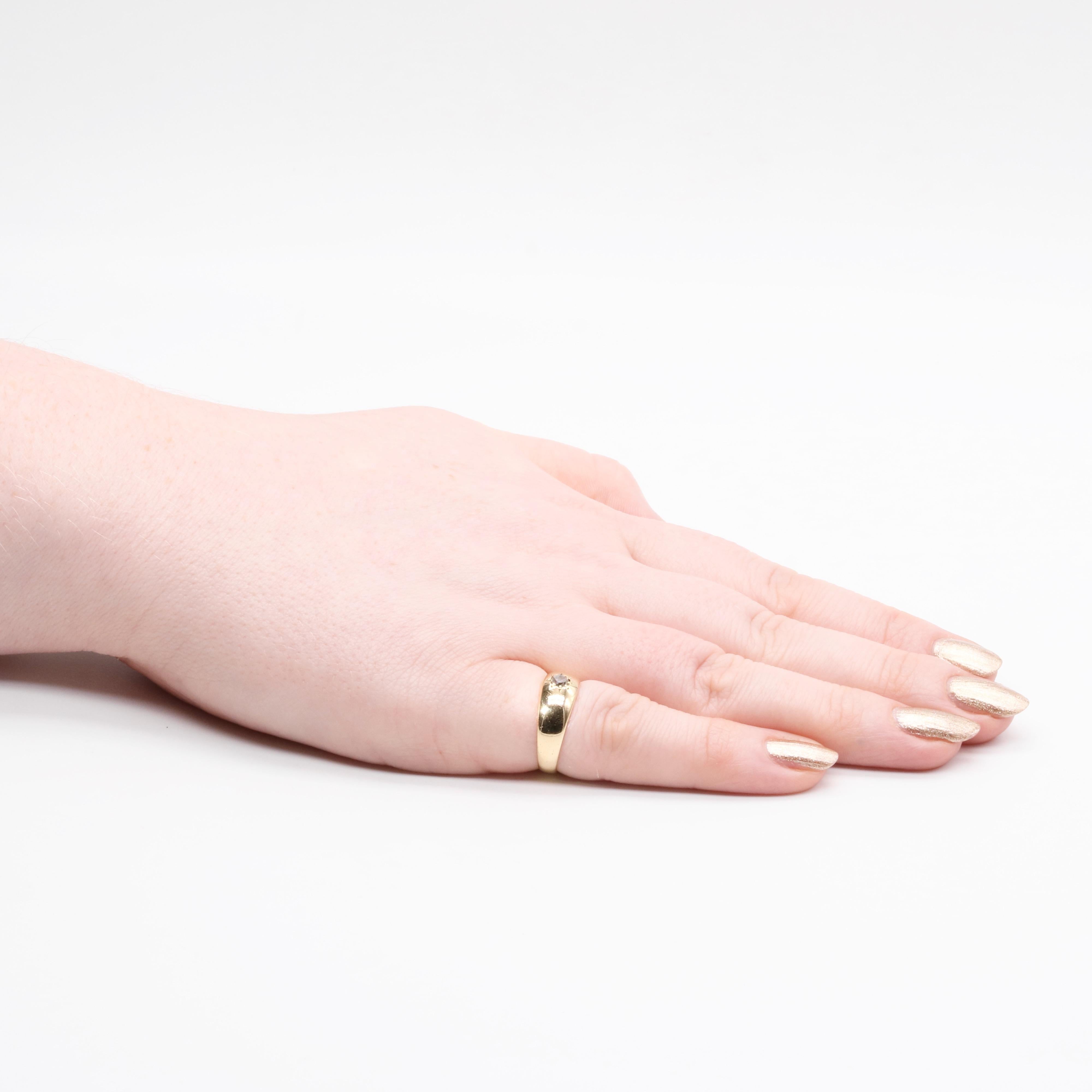 An antique diamond and yellow gold ring, comprising one old mine cut diamond, set in 18 karat yellow gold, to a band of 18 karat yellow gold. 

The ring is set to the centre with a sparkling old mine cut diamond. The diamond has a deep sparkle that