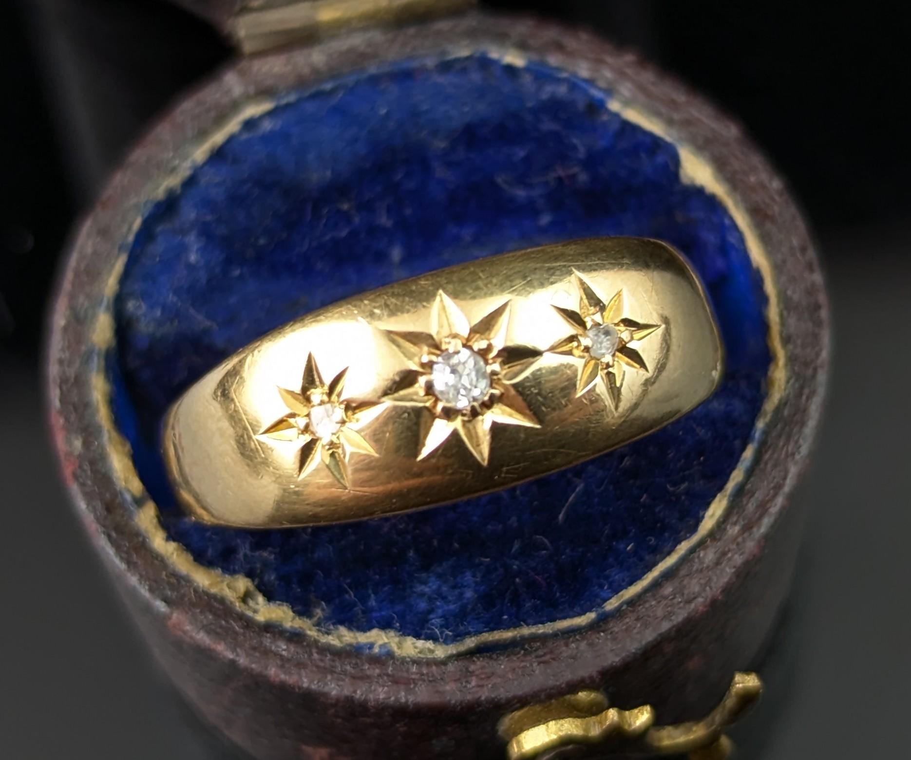 A gorgeous antique 18ct yellow gold star set ring.

It has a slightly domed face with three sparkling diamonds set into it in star shaped settings, the diamonds have a lovely twinkle on movement and are nice and bright.

It has graduated shoulders