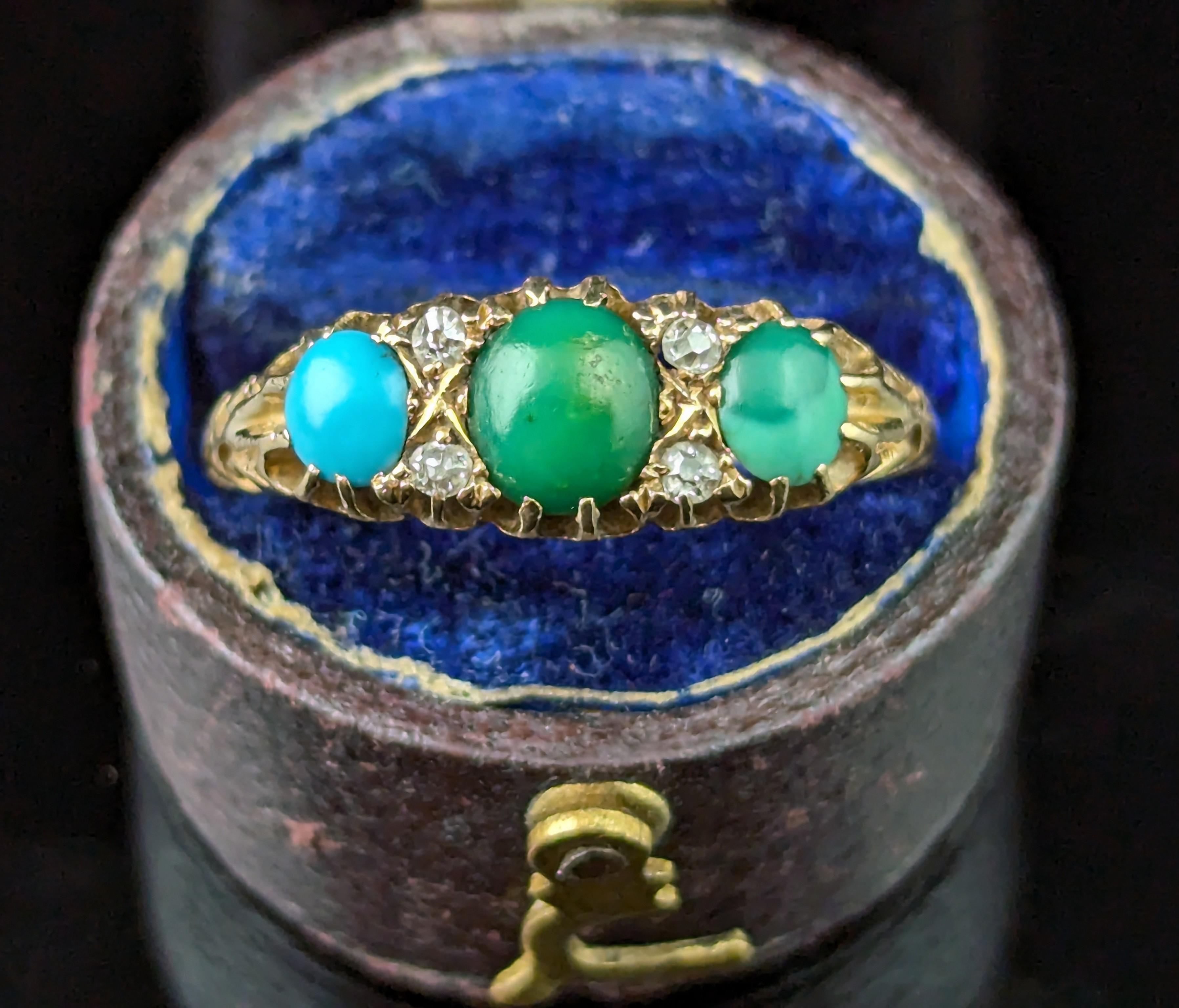 A gorgeous antique 18ct yellow gold Turquoise and Diamond ring.

Rich, buttery 18ct gold with carved shoulders and a lovely smooth band.

The face houses three claw set turquoise cabochons in varying shades, the largest to the centre with diamond