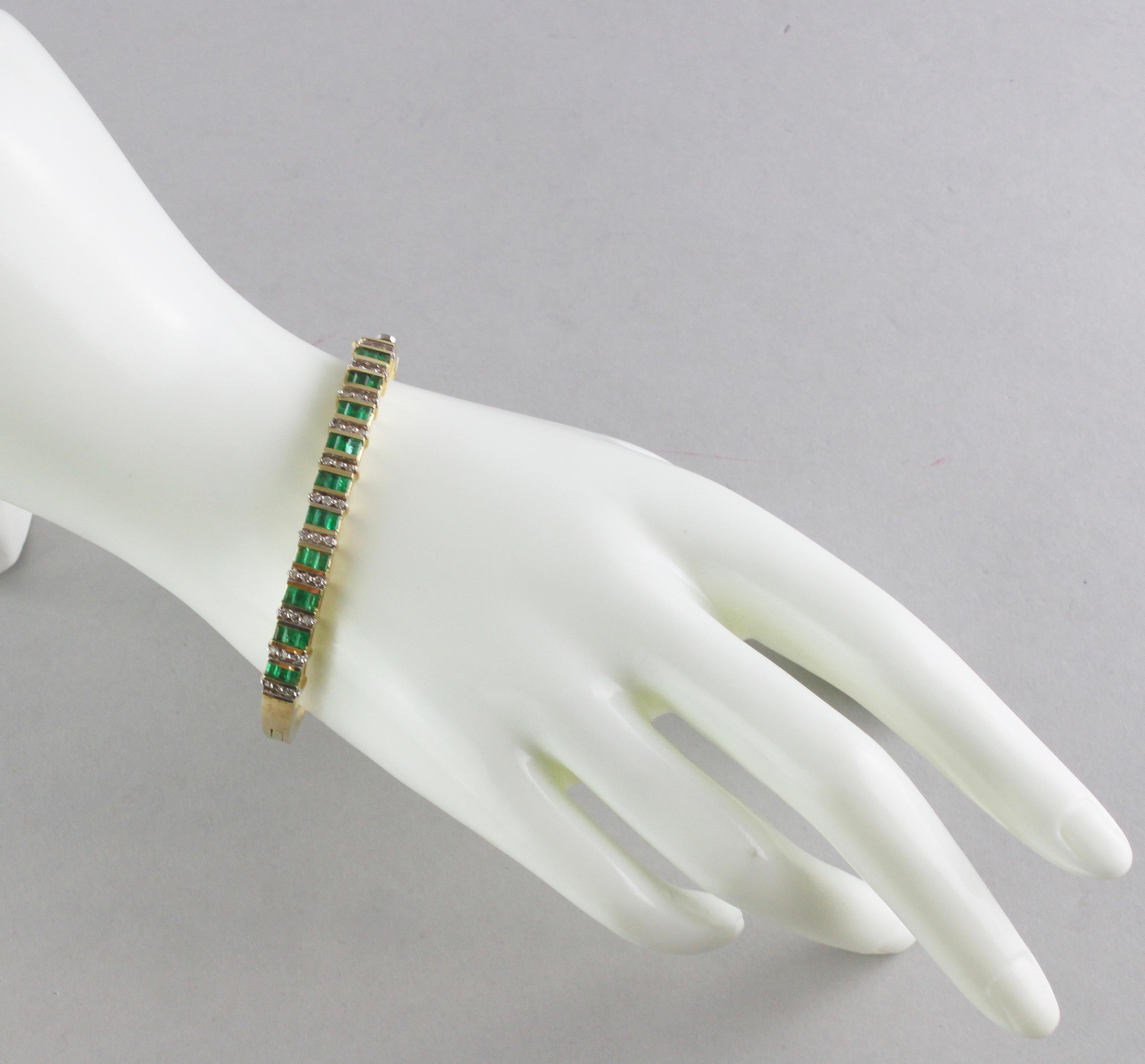 Antique 18kt yellow gold ladies bangle, with emeralds and diamonds.
European Circa 1940.
Tested positive for 18kt gold.

Dimensions -
Size : 7 x 5.9 x 0.75 cm
Weight: 28 grams total

Emeralds - 
Cut : Baguette
Quantity : 30 emeralds
Approx total