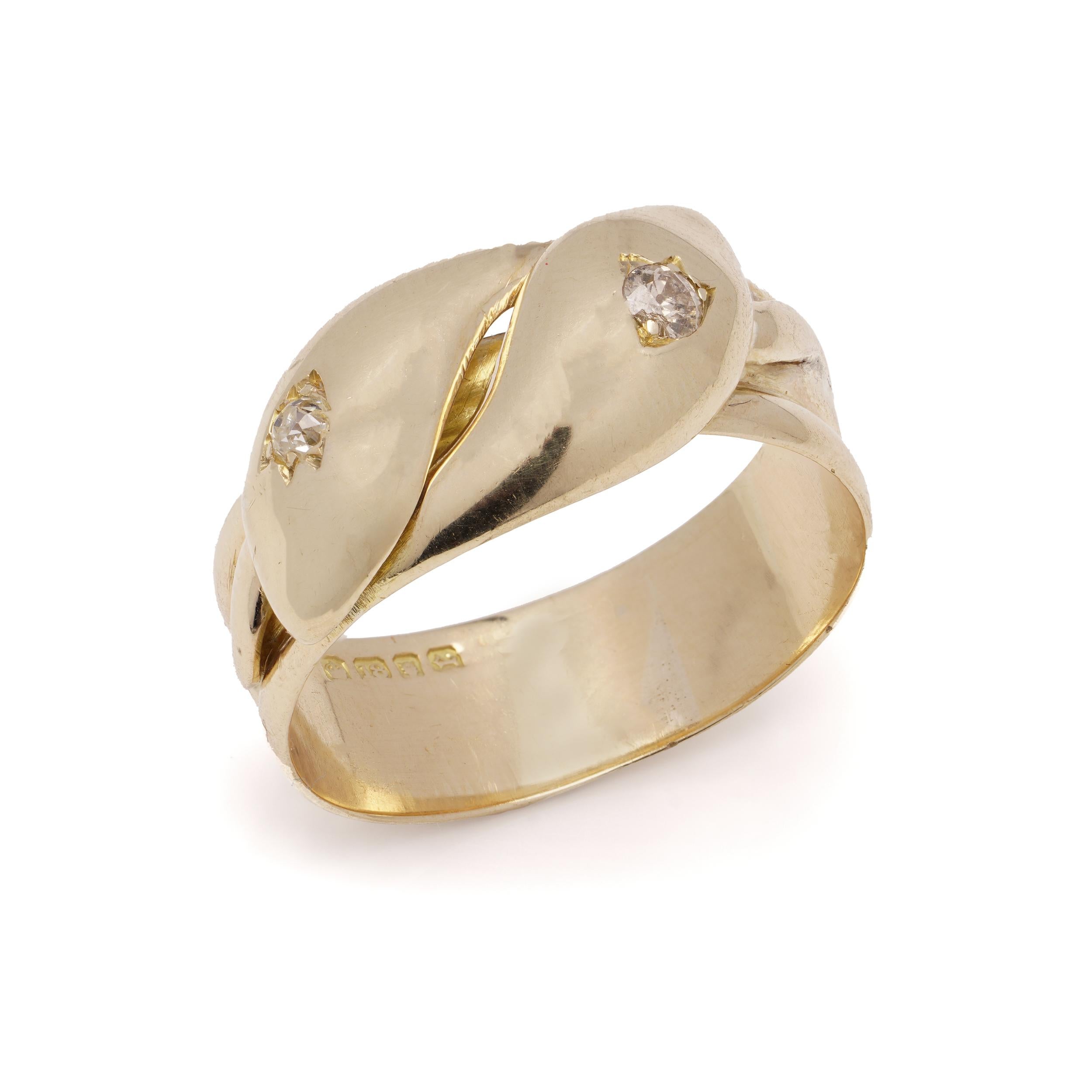 Antique 18kt. yellow gold men's large-size band ring in the shape of a pair of coiled snakes,  set with two old-cut diamonds. 
Made in the United Kingdom, London, 1920 
Hallmarked with London town mark and the date letter, maker's mark partially