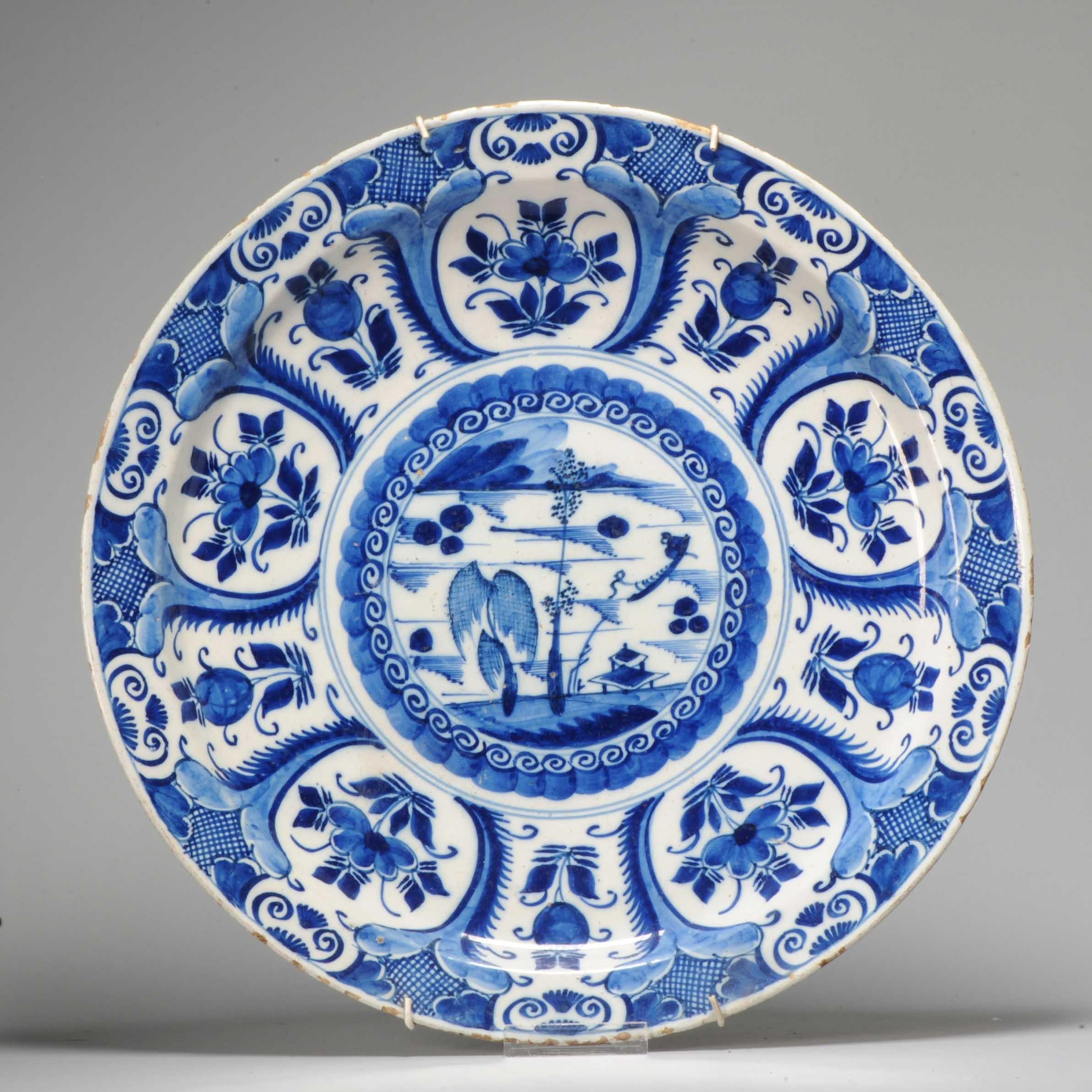 Earthenware dish with a flat rim. Decorated in different shades of blue on a white tin glaze

Condition
typical rimfritting only. Size 400 x 50mm Diameter x Height
Period
18th century.