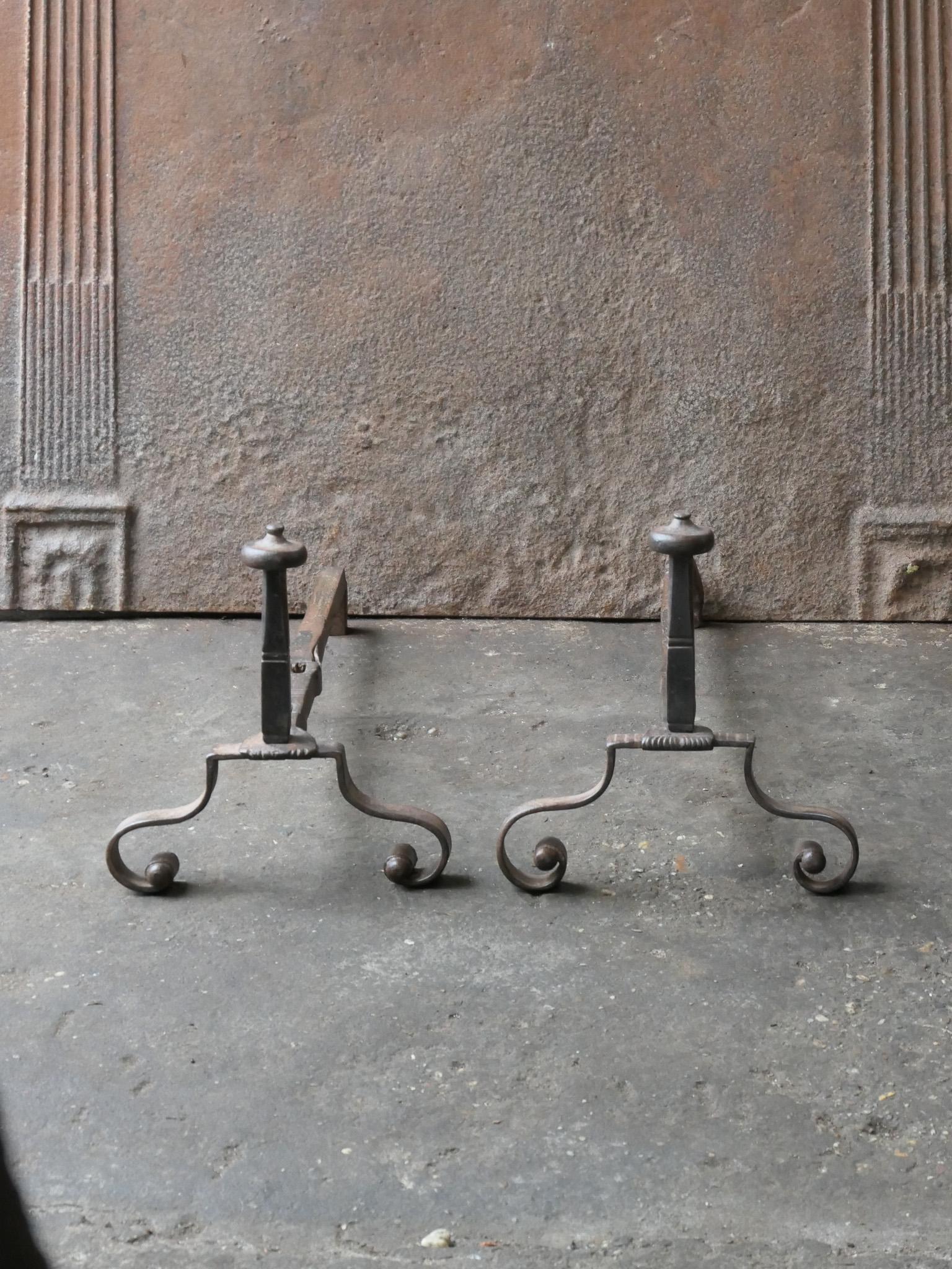 18th century French Louis XV period andirons. Made of wrought iron. The andirons are in a good condition and are fully functional.