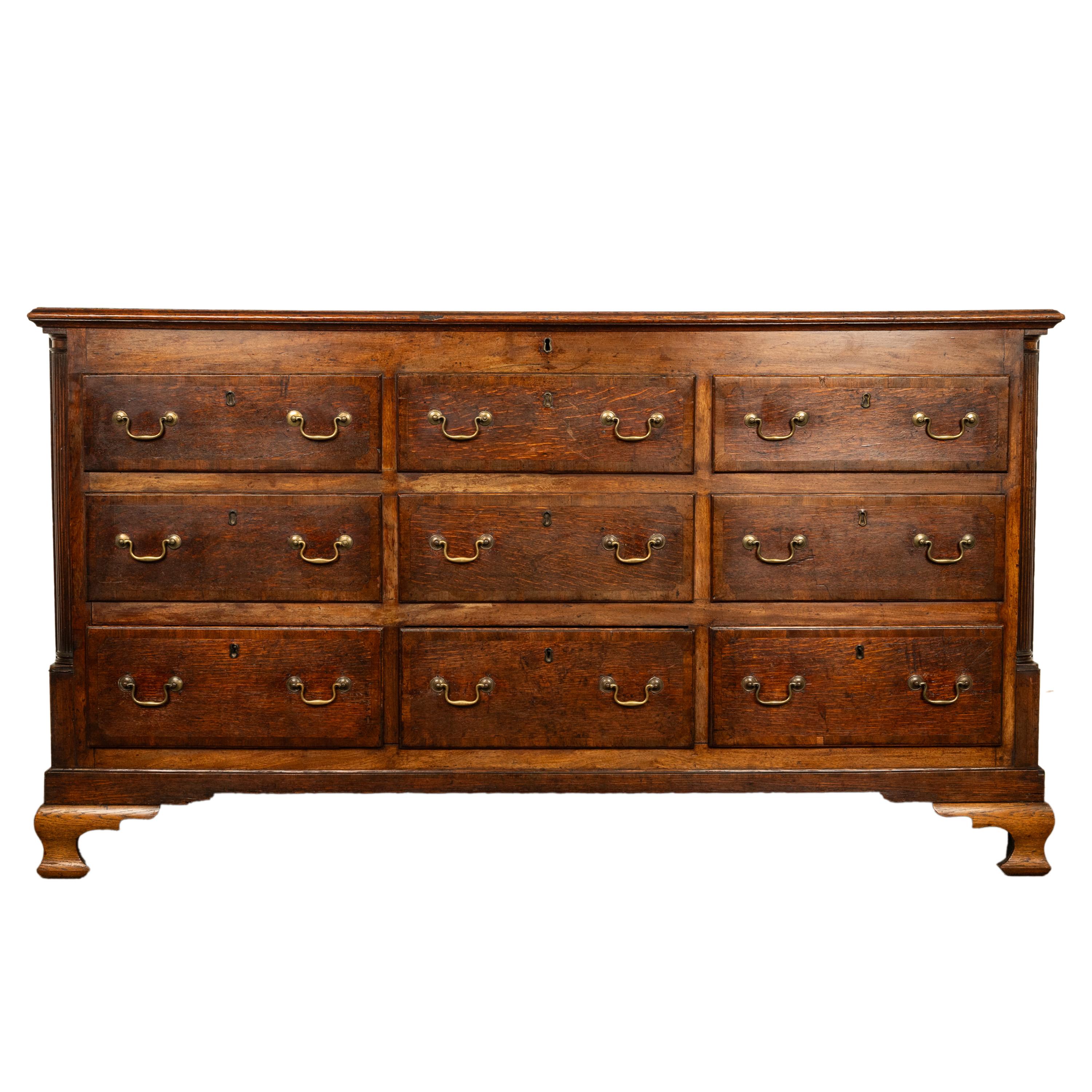 A good & large antique Lancashire country oak mule chest, coffer, sideboard, circa 1770.
The chest having a hinged top enclosing a large storage area for bedding and clothing or? The two top banks of drawers are dummy drawers and the bottom three