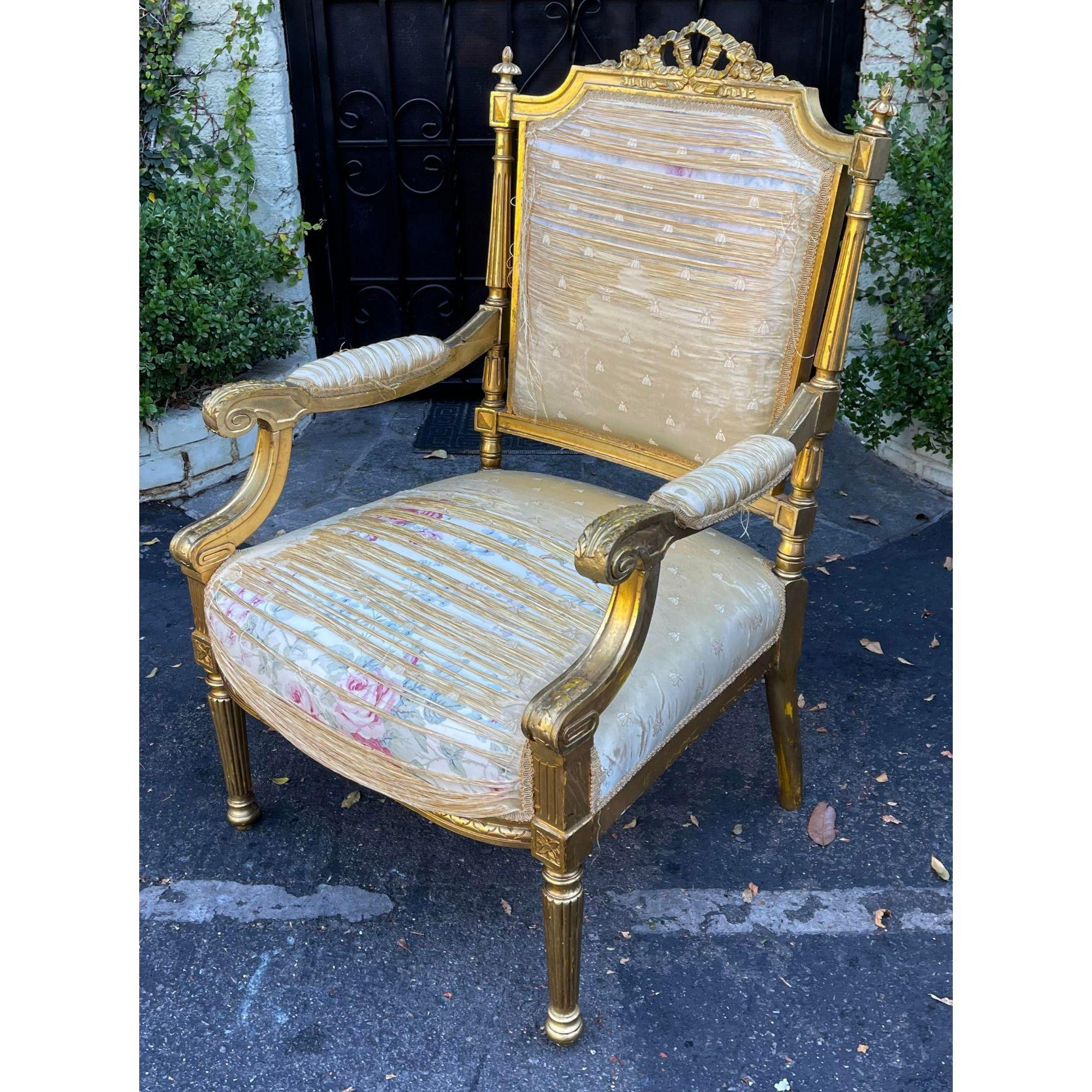 Antique 18th Century Louis XVI Giltwood Fauteuil armchair. This lovely chair is a genuine antique and feature a genuine giltwood finish. It is beautifully worn and the silk upholstery is absolutely shredded and reveals old floral fabric underneath