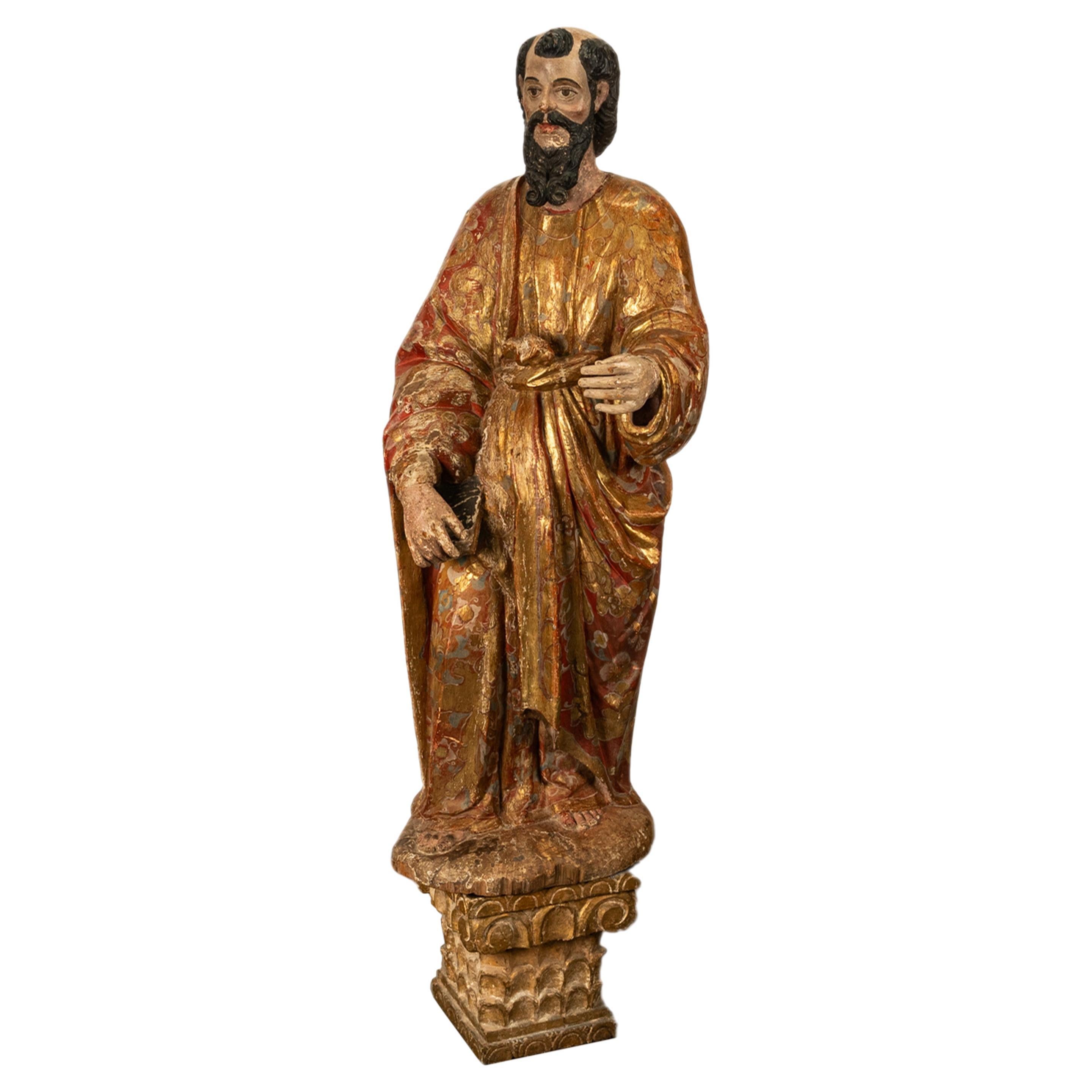 A rare antique Spanish Colonial life size carved Santo figure of St. Paul the Evangelist, Mexico, circa 1750.
A wonderful carved colonial statue in the style of the Castilian School, the statue depicts St. Paul holding a bible in his left hand and