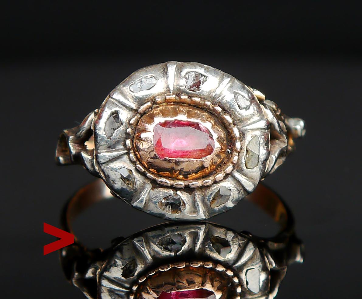 Antique Ruby and Diamond Halo Ring.

Likely 18th. century piece, French or German. No hallmarks, band tested close to 14K Gold.

Silver flower crown 15 mm x 13 mm x 6 mm deep.

Natural Ruby set in Gold bezel of old cushion irregular cut 5.5 mm x 4