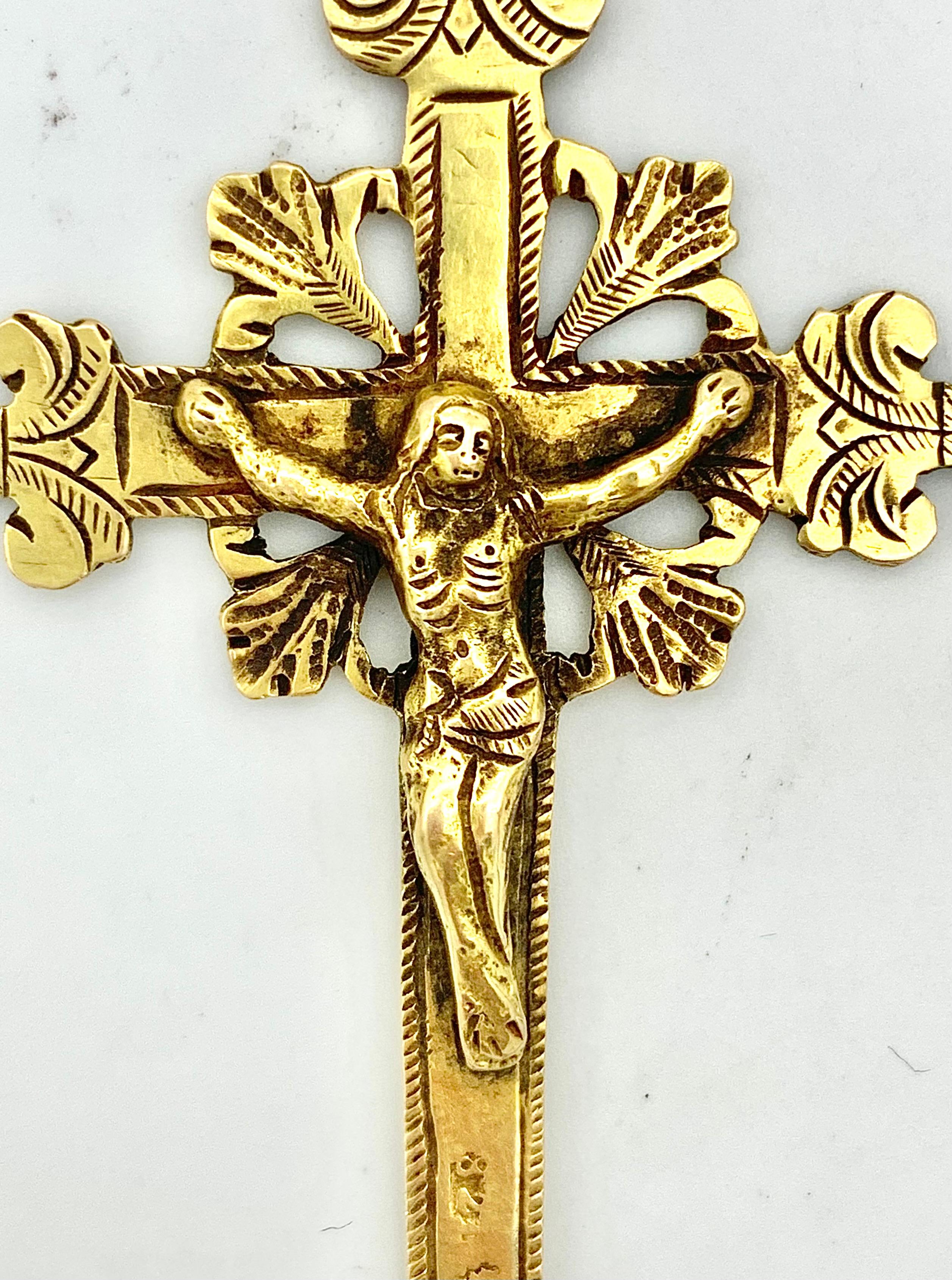 This pendant of Christ on the cross was cast in Italy in the last quarter of the 18th century.  The cross is marked with Italian hallmarks engraved and embellished with oriental pearls.  