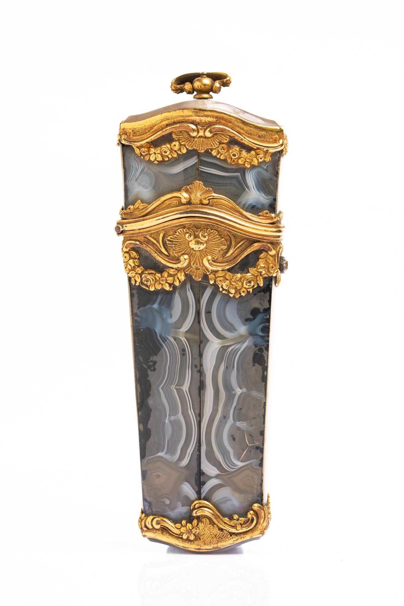 This exquisite late 18th century grey agate and gild metal French rococo nécessaire is dated circa 1760. Tapering rectangular case of grey agate has domed top and base is beautifully decorated with pierced gilt-metal mounts with scrolls, foliage,