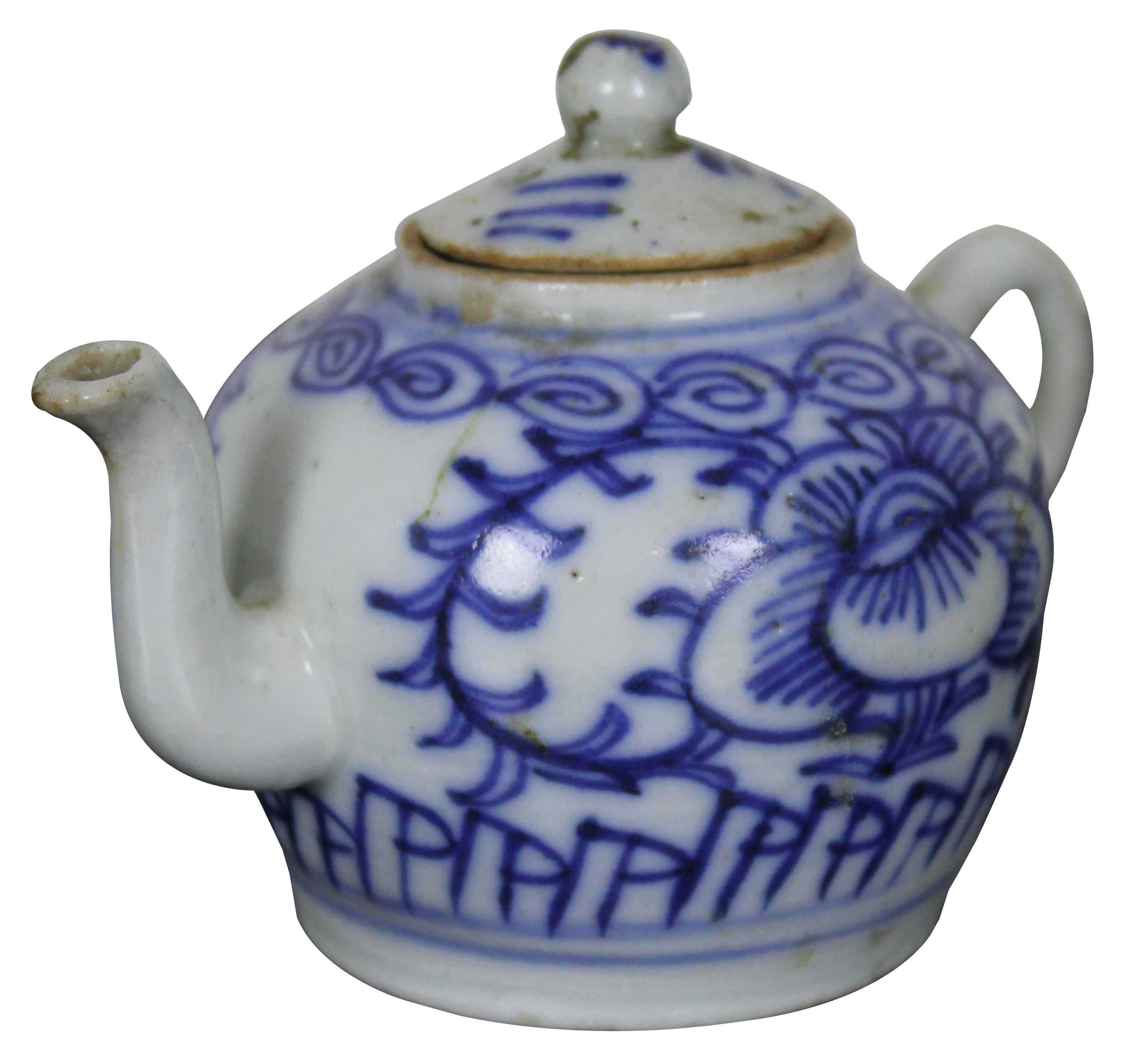 Antique 18th century Chinese Qing Dynasty blue and white porcelain creamer or teapot with floral designs. Measure: 5