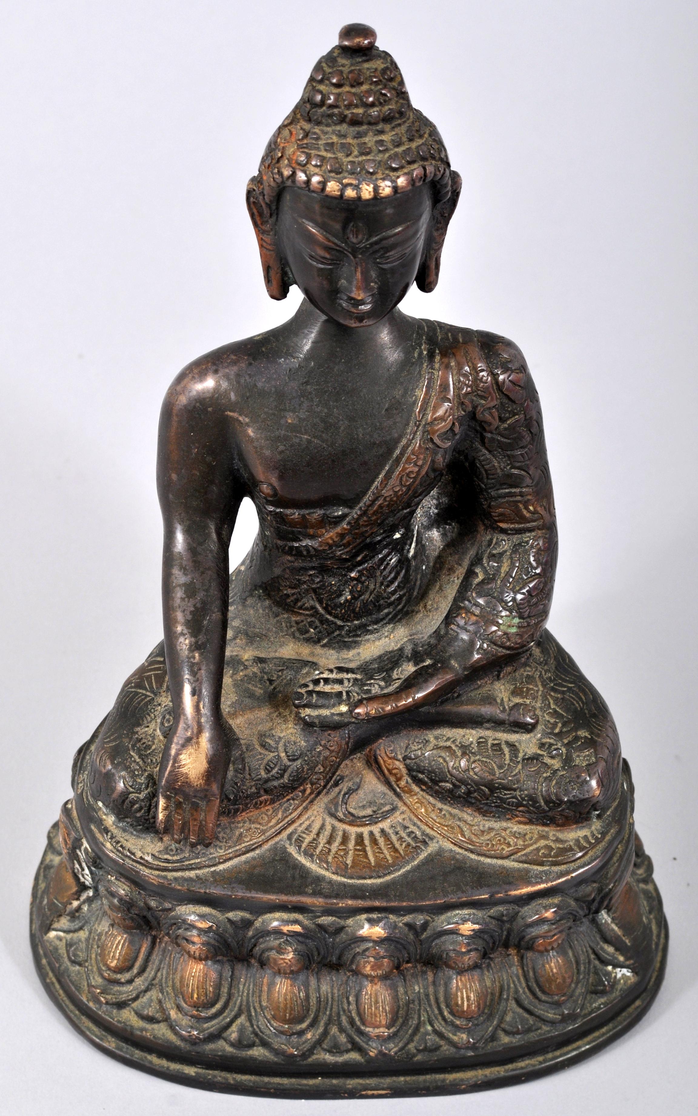 Antique 18th century Chinese bronze Shakyamuni Buddha Statue. The statue finely modeled as Buddha seated upon a lotus thrown in a meditative repose.