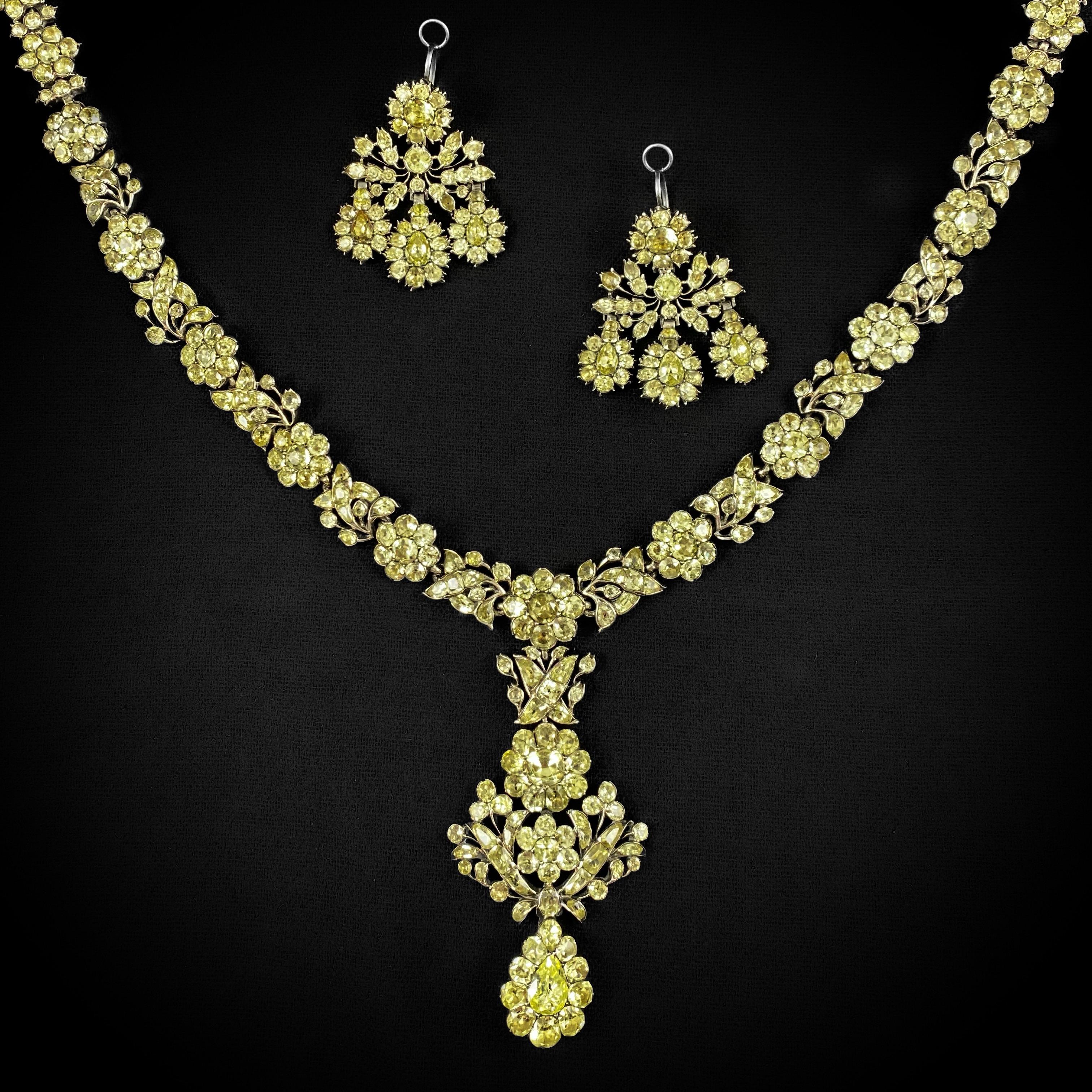 Museum-quality rare and important antique 18th century chrysolite chrysoberyl girandole earrings and necklace demi-parure mounted in closed-back silver, Portuguese, circa 1770, fitted in a later Victorian 19th century case. The necklace is designed