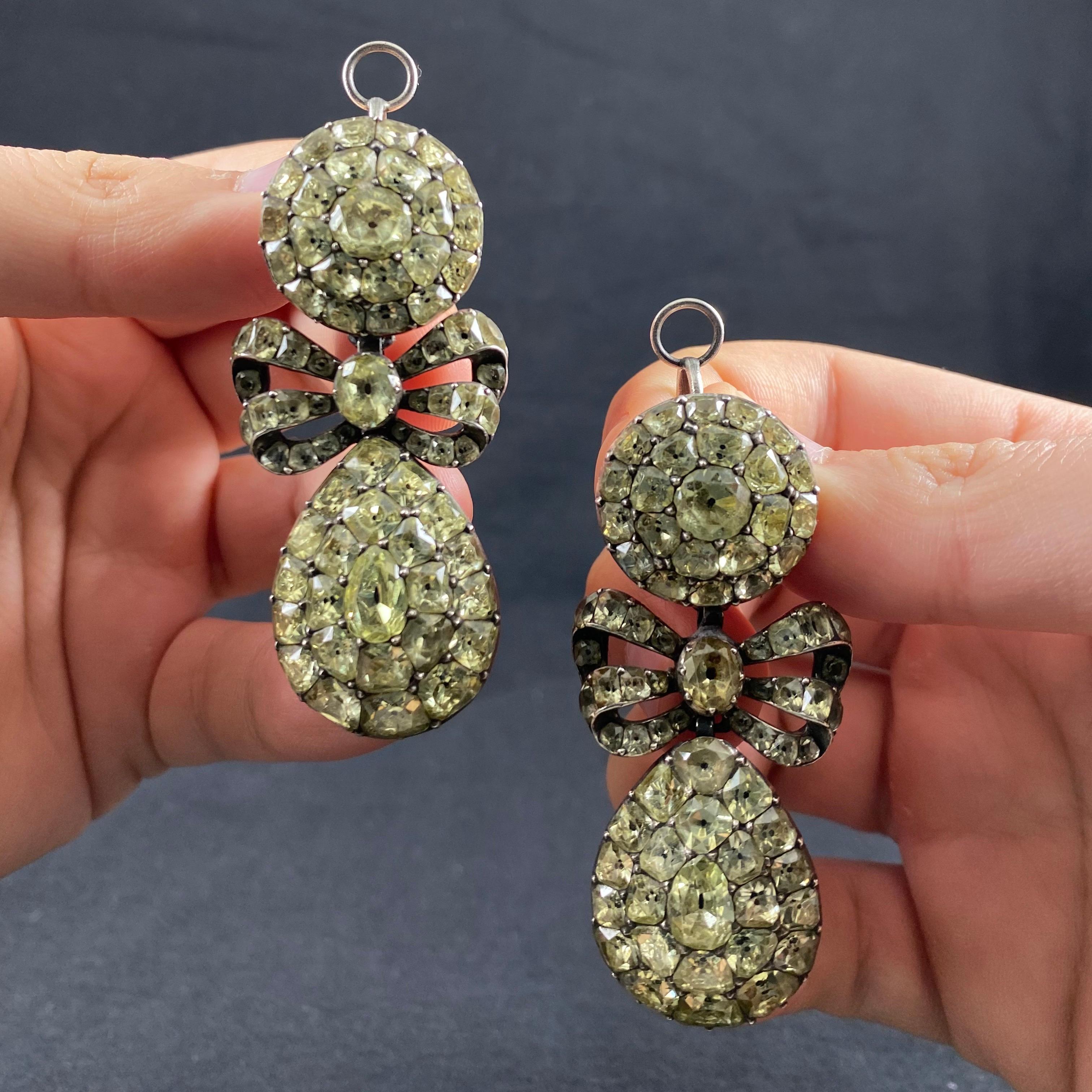Extremely Rare Museum Quality Antique 18th Century Chrysolite Chrysoberyl Pendeloque Pendant Earrings, Portugal, c. 1770, fitted in antique red leather case with golden decorative accents. Each earring is designed with a circular cluster surmount,