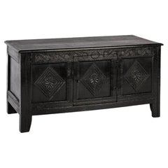 Antique 18th century converted blacked oak and carved English chest or trunk
