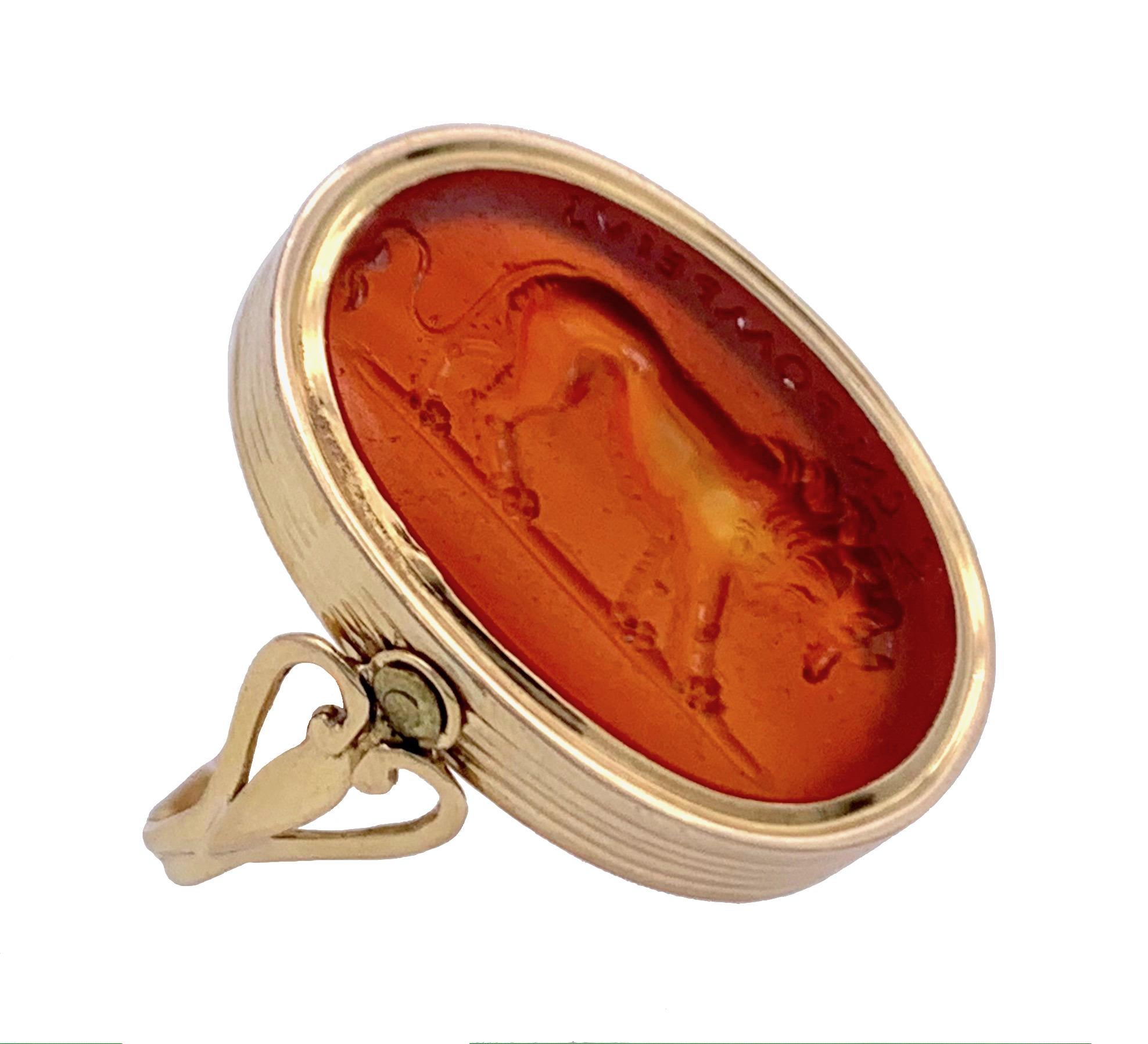 The oval carnelian intaglio of a lion has been mounted in the late 18th century in a revolving ring.
