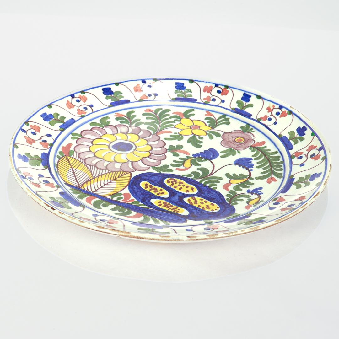 19th Century Antique 18th Century De Klaauw Dutch Delft Pottery Floral Plate For Sale