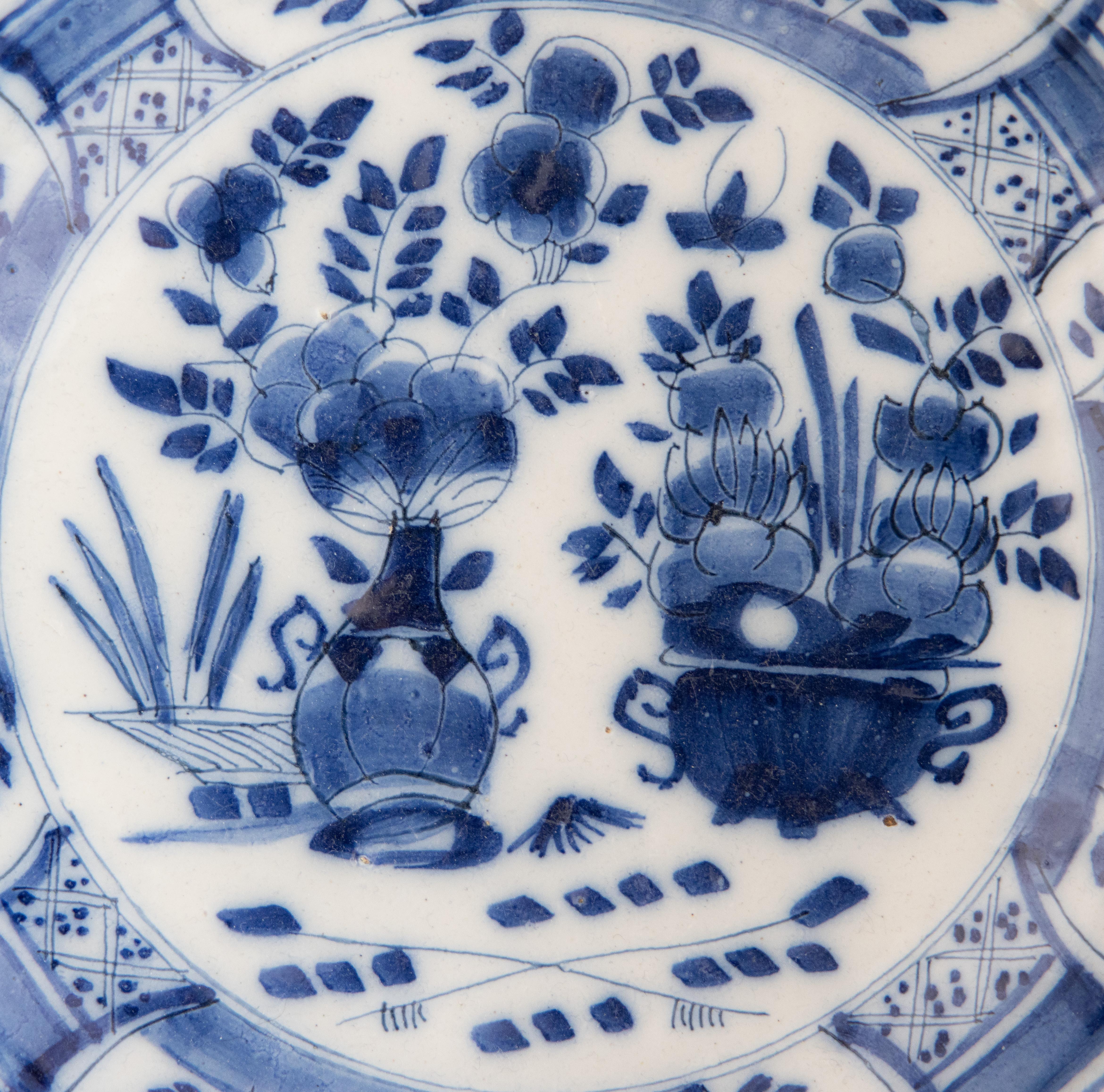 A lovely antique 18th-Century Dutch Delft Chinoiserie hand painted floral plate in vibrant cobalt blue and white. It would look fabulous displayed on a wall or shelf in any room. A classic and timeless piece that will never go out of