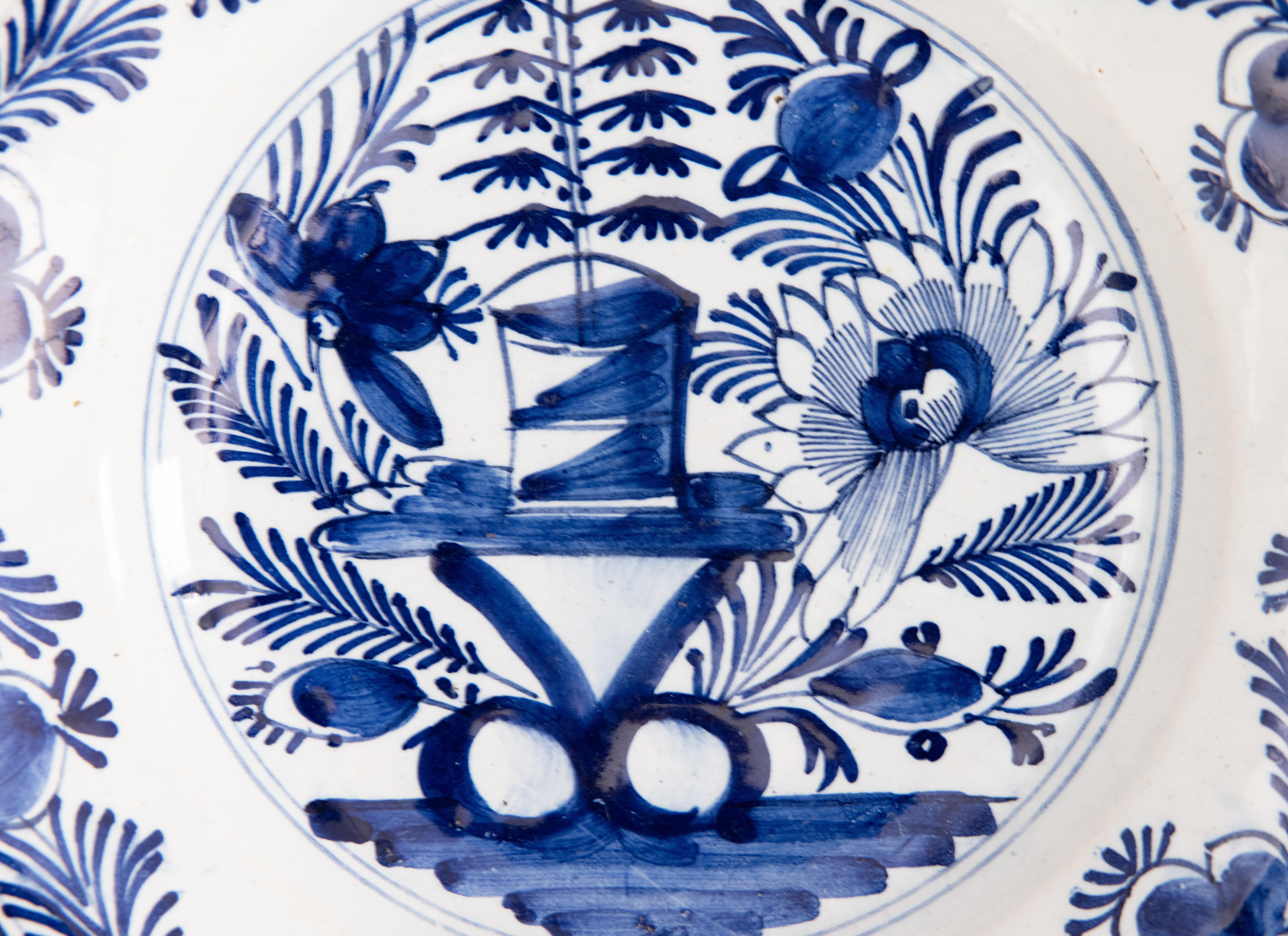 A lovely antique 18th-Century Dutch Delft faience hand painted floral plate in vibrant cobalt blue and white. It would look fabulous displayed on a wall or shelf in any room.

DIMENSIONS
9ʺW × 1.5ʺD × 9ʺH