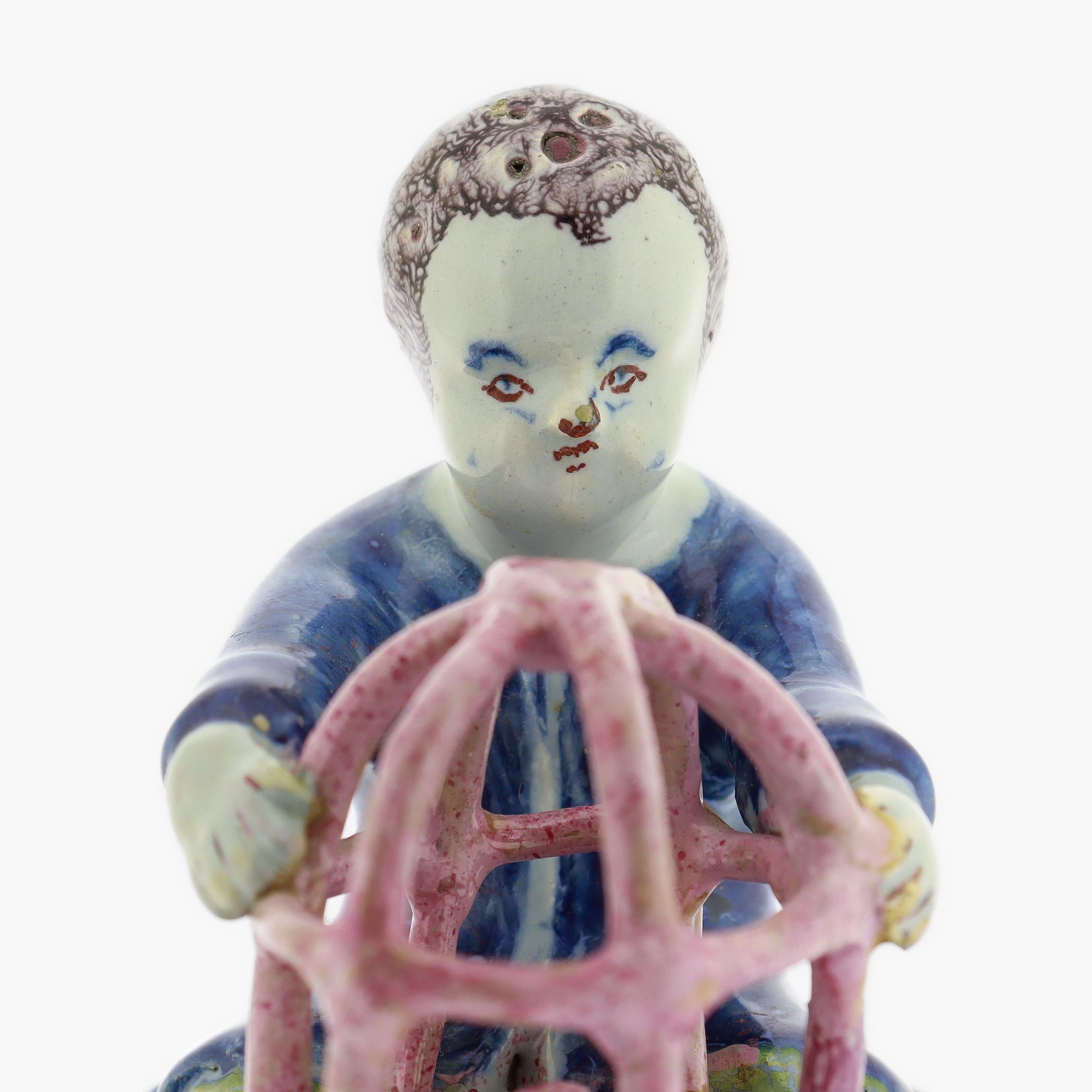 Antique 18th Century Dutch Delft Figurine of a Boy holding a Birdcage with Bird For Sale 6