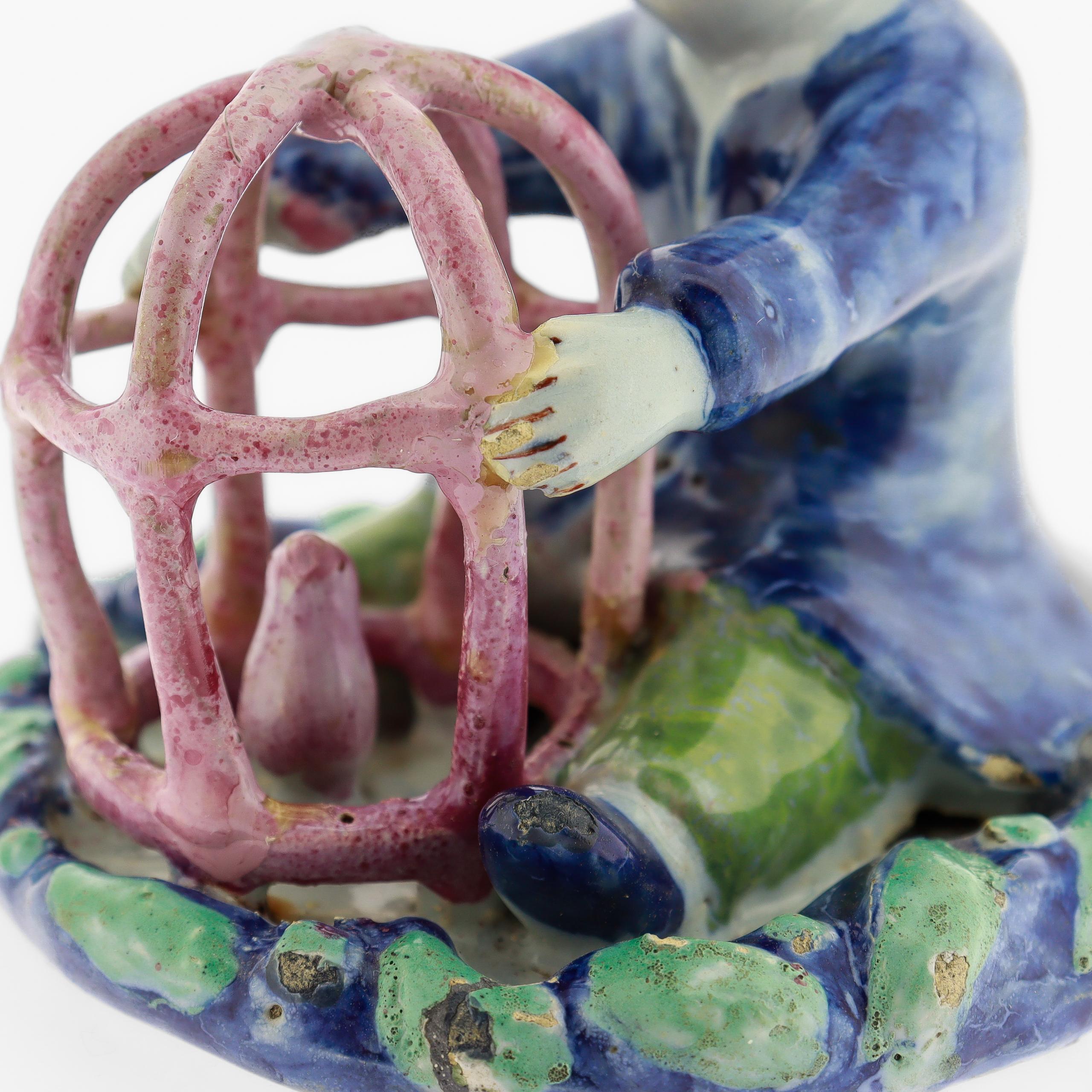 Antique 18th Century Dutch Delft Figurine of a Boy holding a Birdcage with Bird For Sale 9