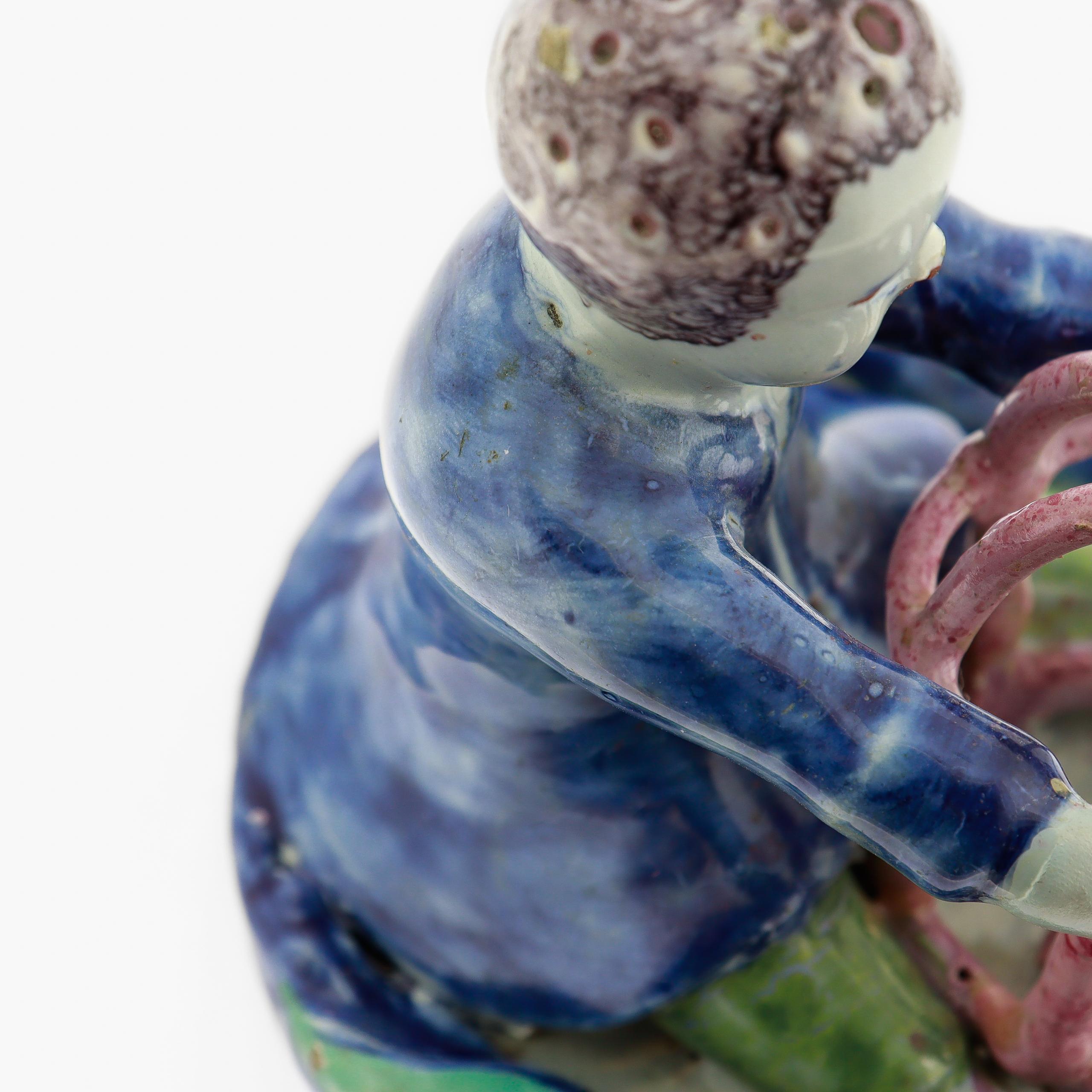 Antique 18th Century Dutch Delft Figurine of a Boy holding a Birdcage with Bird For Sale 12