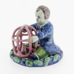 Antique 18th Century Dutch Delft Figurine of a Boy holding a Birdcage with Bird
